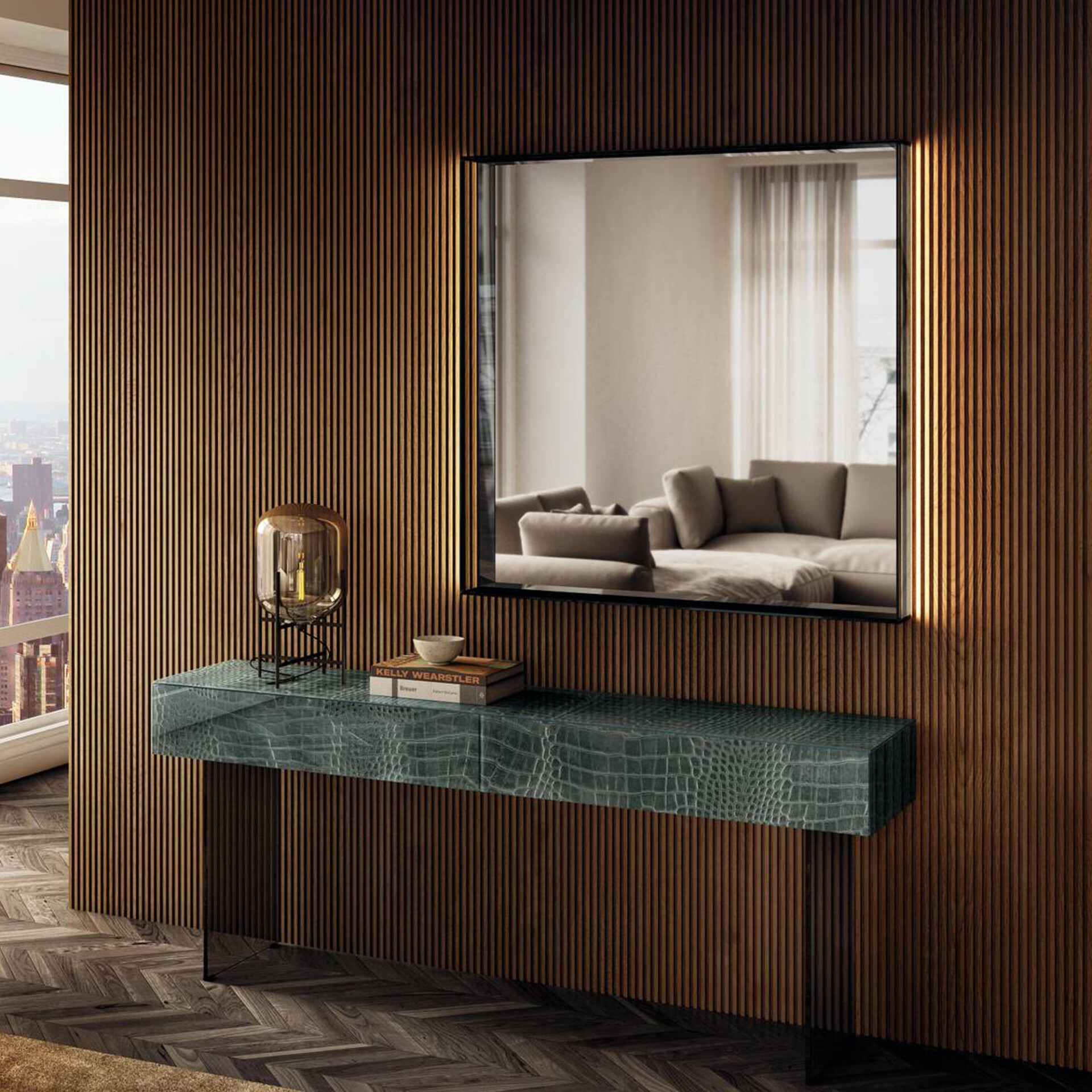 A luxurious modern entryway with a dark wood slatted wall, a backlit rectangular mirror reflecting a living room, and a teal crocodile-textured console table. The console holds a modern lamp and books, while a city skyline is visible through a window.