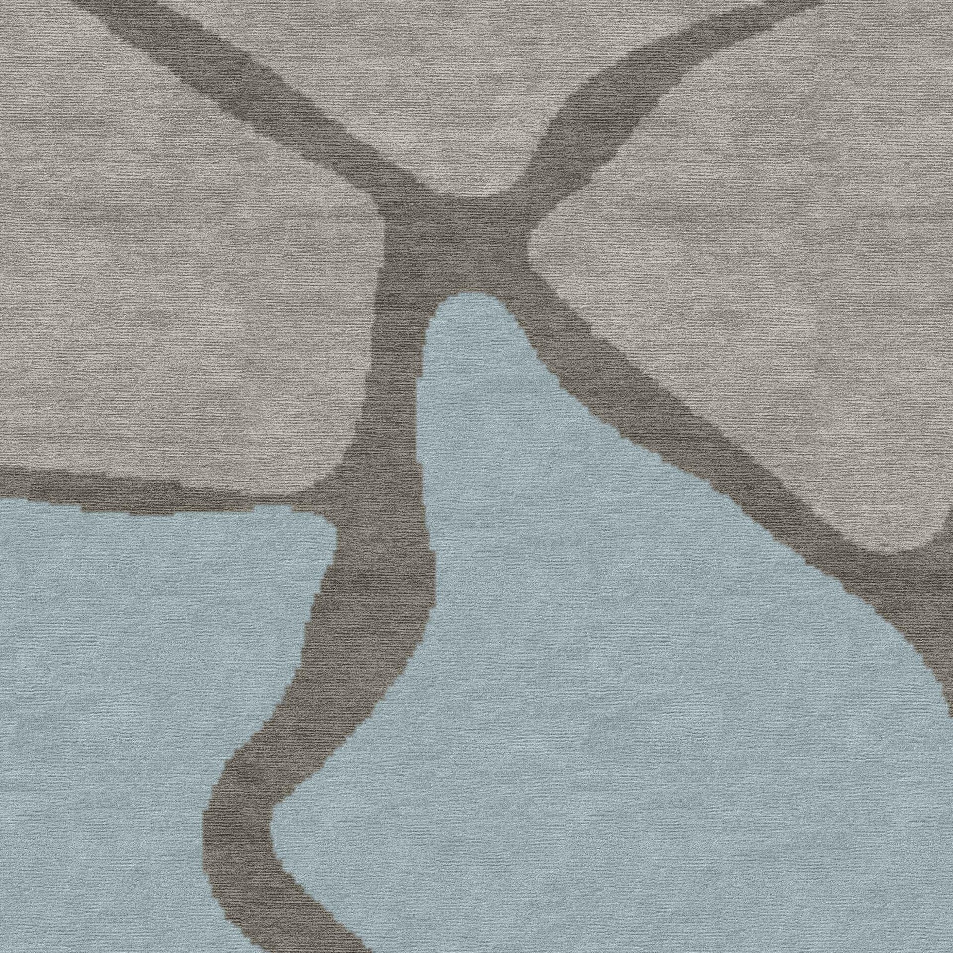 Close-up of an abstract rug with an organic pattern in light grey, muted blue, and dark grey.