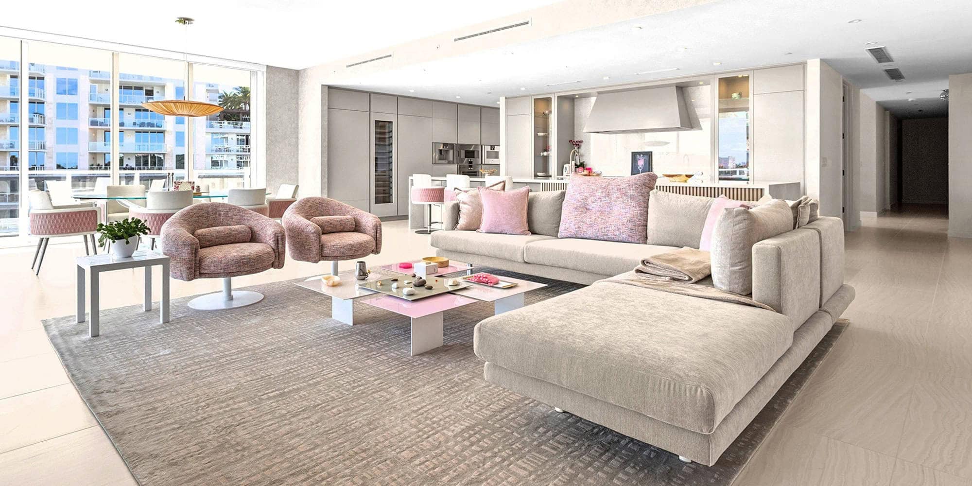 personalized-condo-from-top-to-bottom-case-study-1.6 Bright, spacious condo living room with large windows and contemporary furniture.