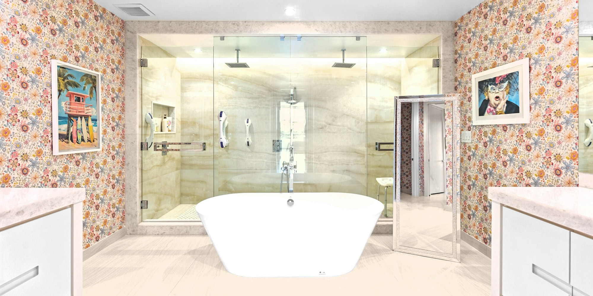 personalized-condo-from-top-to-bottom-case-study-14.1 A vibrant bathroom with floral wallpaper, a white freestanding tub, a glass walk-in shower, and two framed artworks. A decorative floor mirror leans against the right wall.