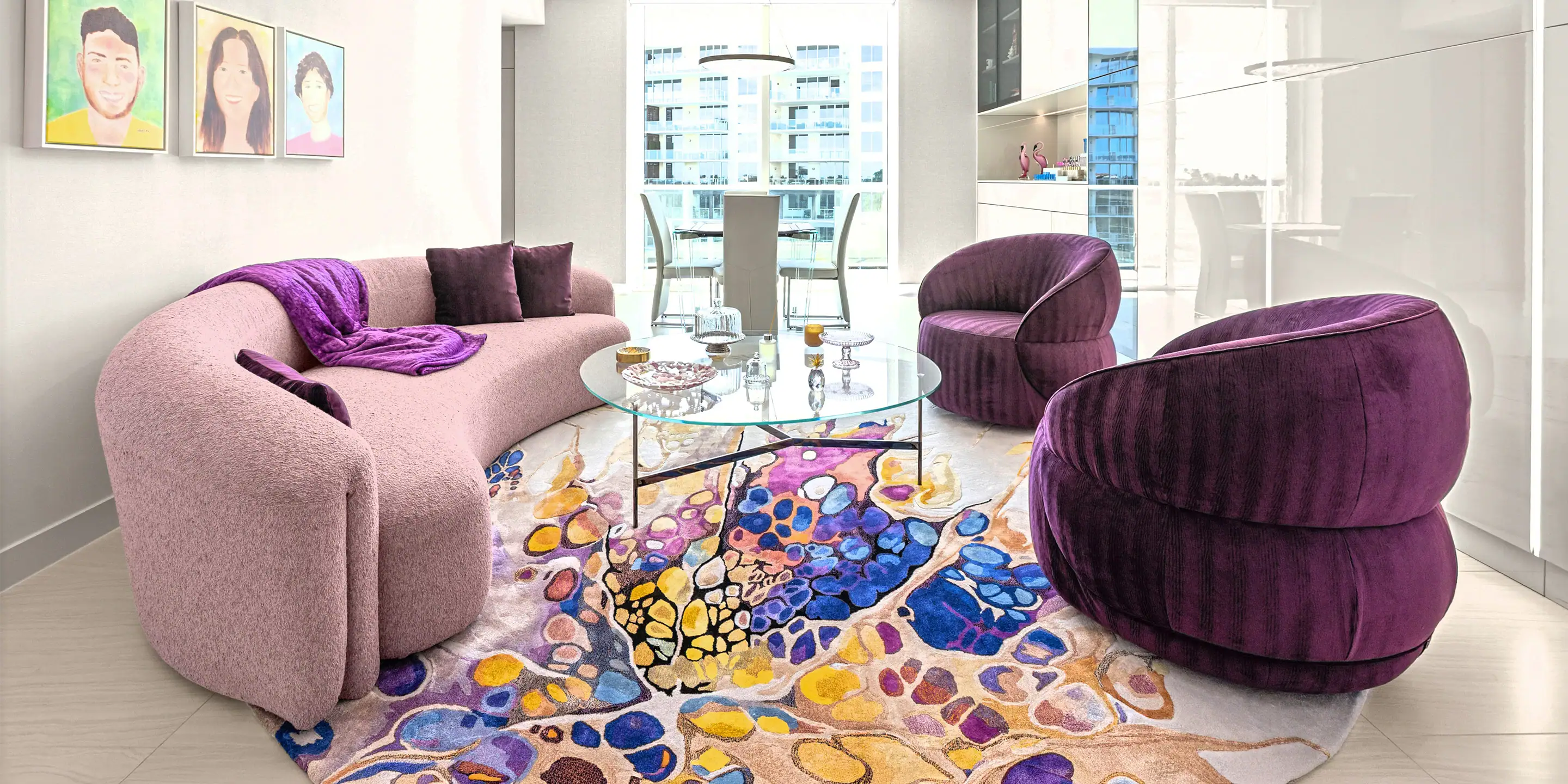 personalized-condo-from-top-to-bottom-case-study-2.4 Elegant pink sofa with purple cushions and throw in a contemporary condo living room.