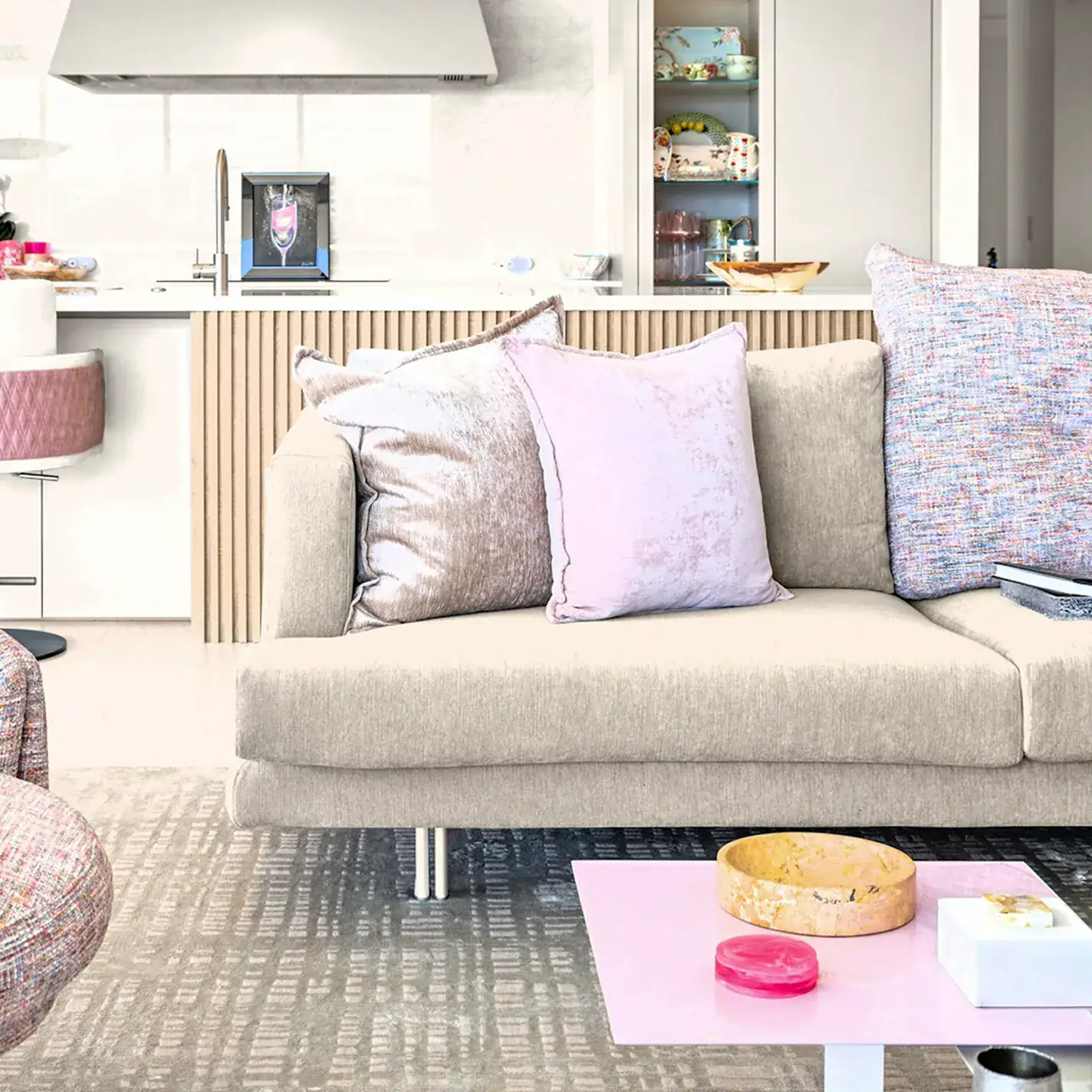 Elegant living room with plush pillows and contemporary decor.