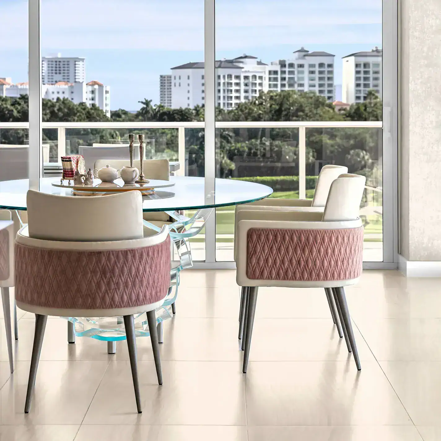 personalized-condo-from-top-to-bottom-case-study-9.1 Elegant condo dining space with contemporary furniture and scenic cityscape backdrop.