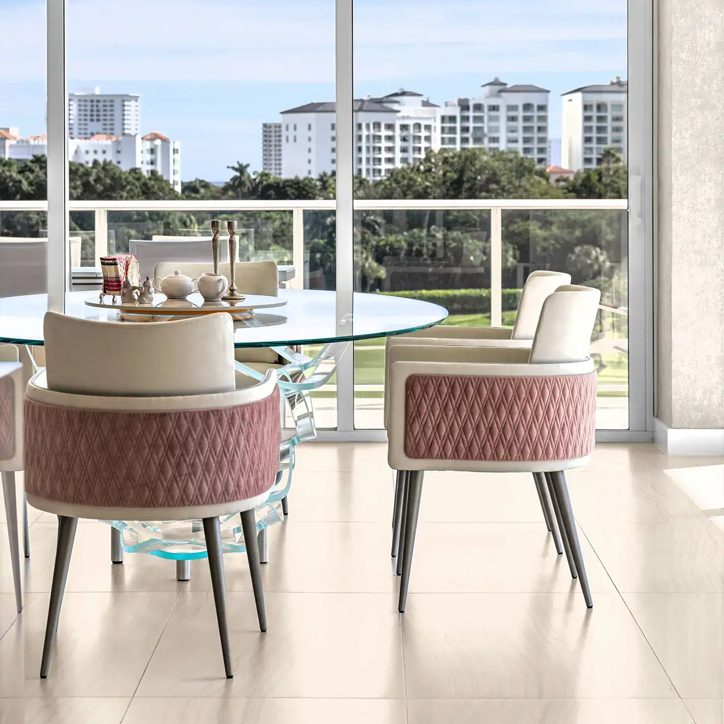 personalized-condo-from-top-to-bottom-case-study-9 Elegant condo dining space with contemporary furniture and scenic cityscape backdrop.