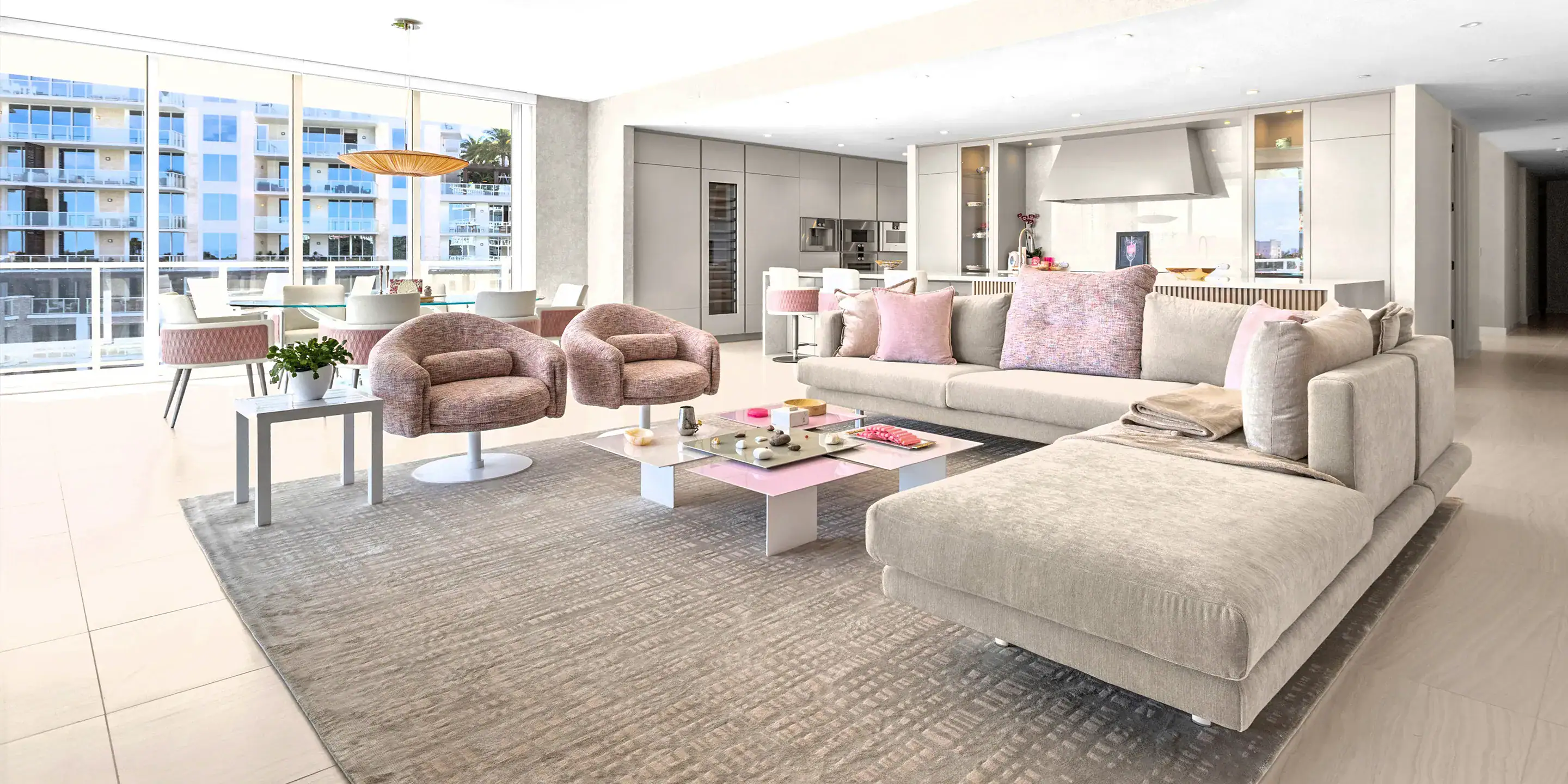 Bright, spacious condo living room with large windows and contemporary furniture.