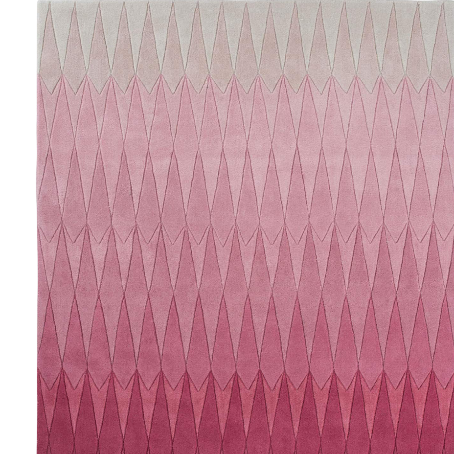 Pink ombre rug with a geometric diamond pattern, transitioning from light pink at the top to dark magenta at the bottom.