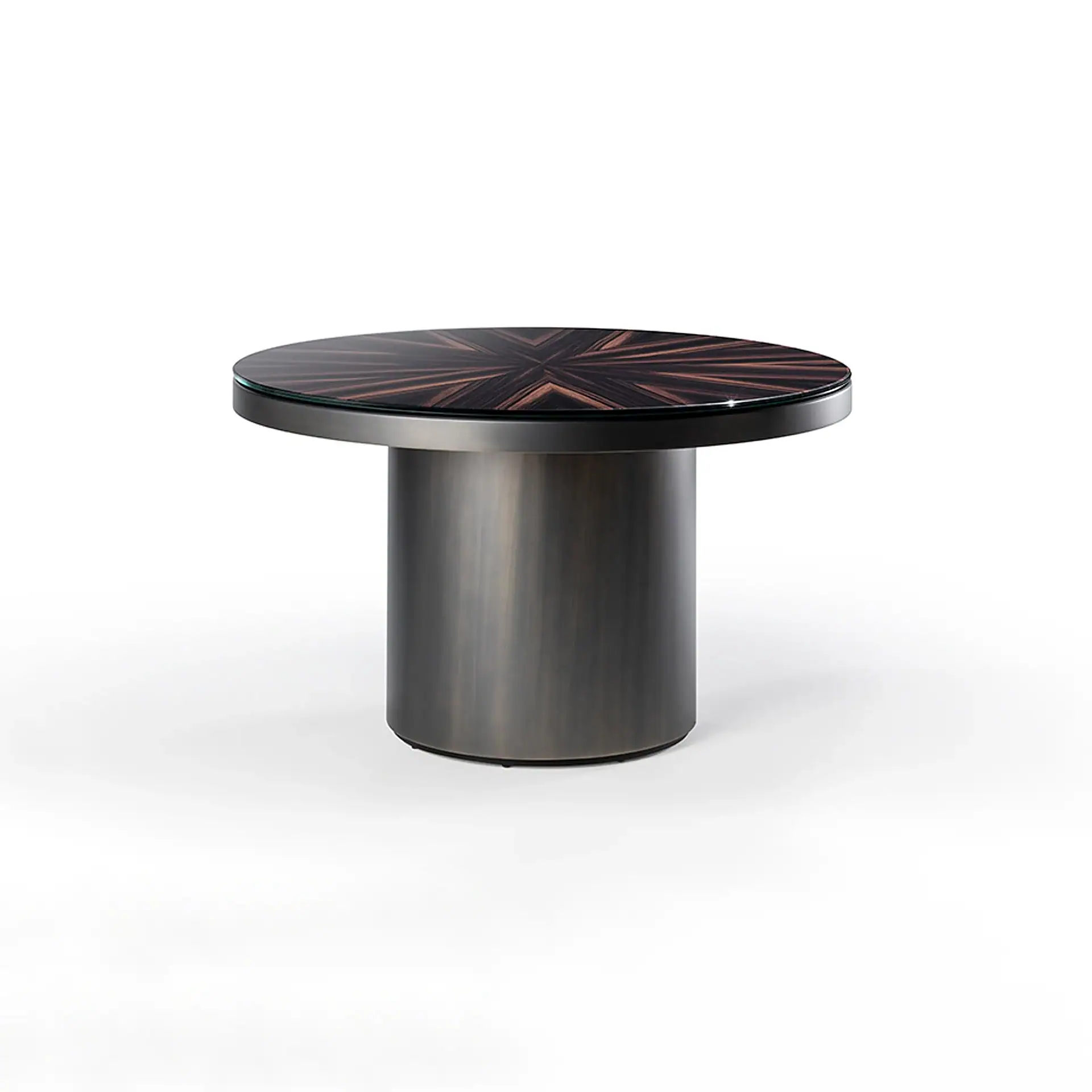 A round table with a dark, starburst-patterned wood top, a clear glass overlay, and a cylindrical dark metallic base.