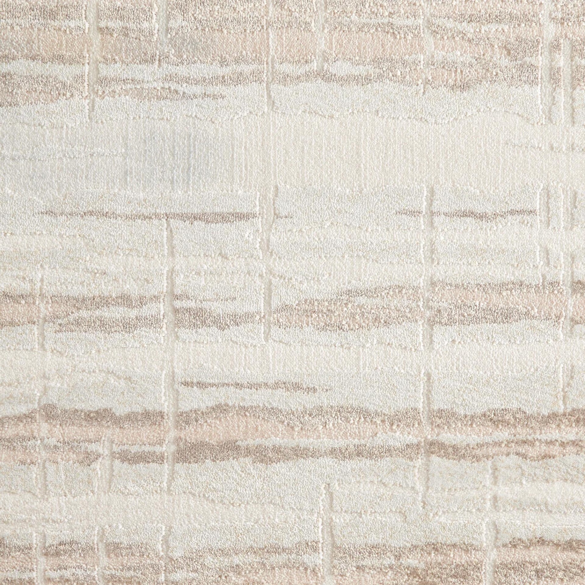 Close-up of a textured fabric or carpet with an abstract pattern of off-white, beige, and light brown horizontal stripes and subtle vertical elements.