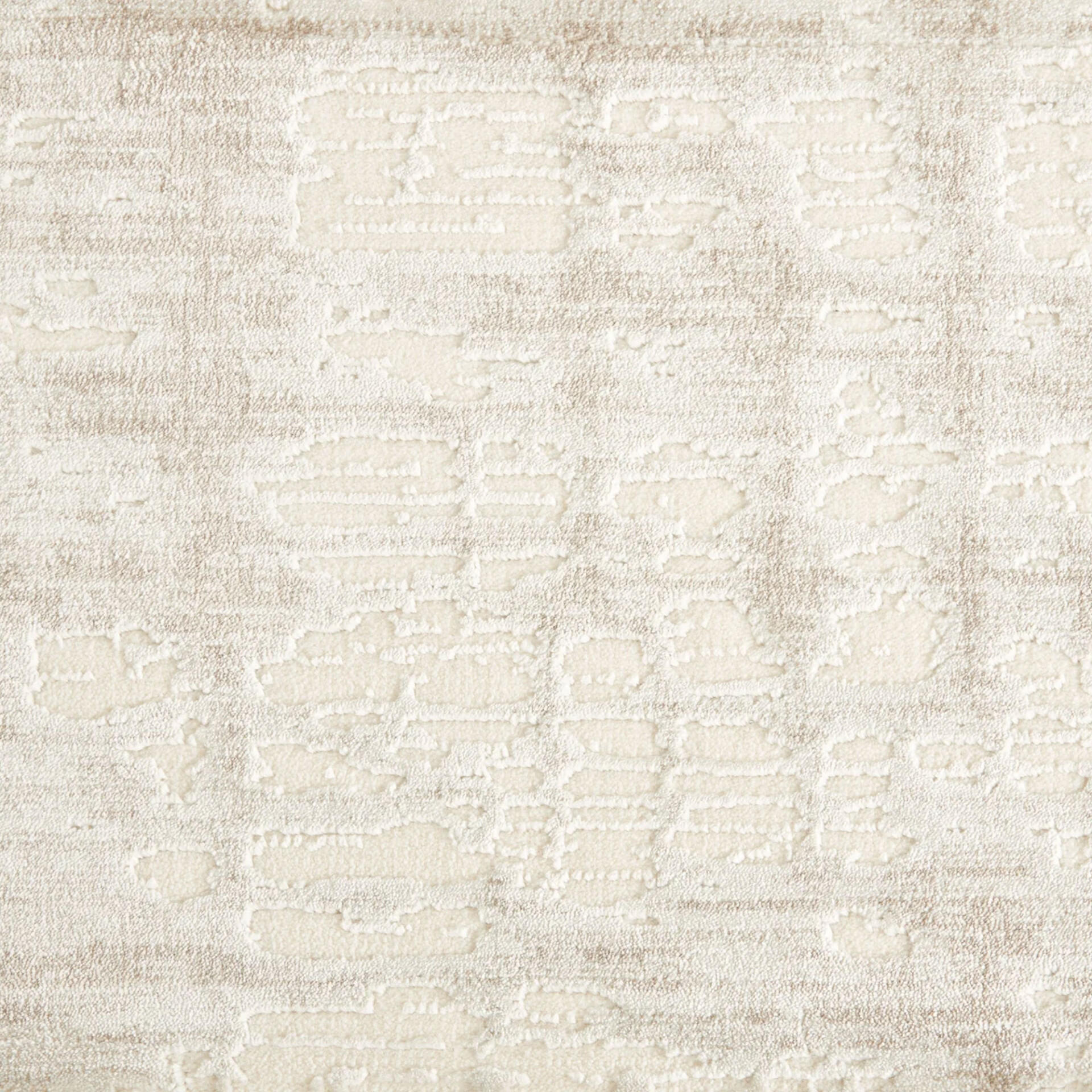 Close-up of a cream and light beige textured fabric or carpet with an abstract, organic pattern created by varying pile heights.