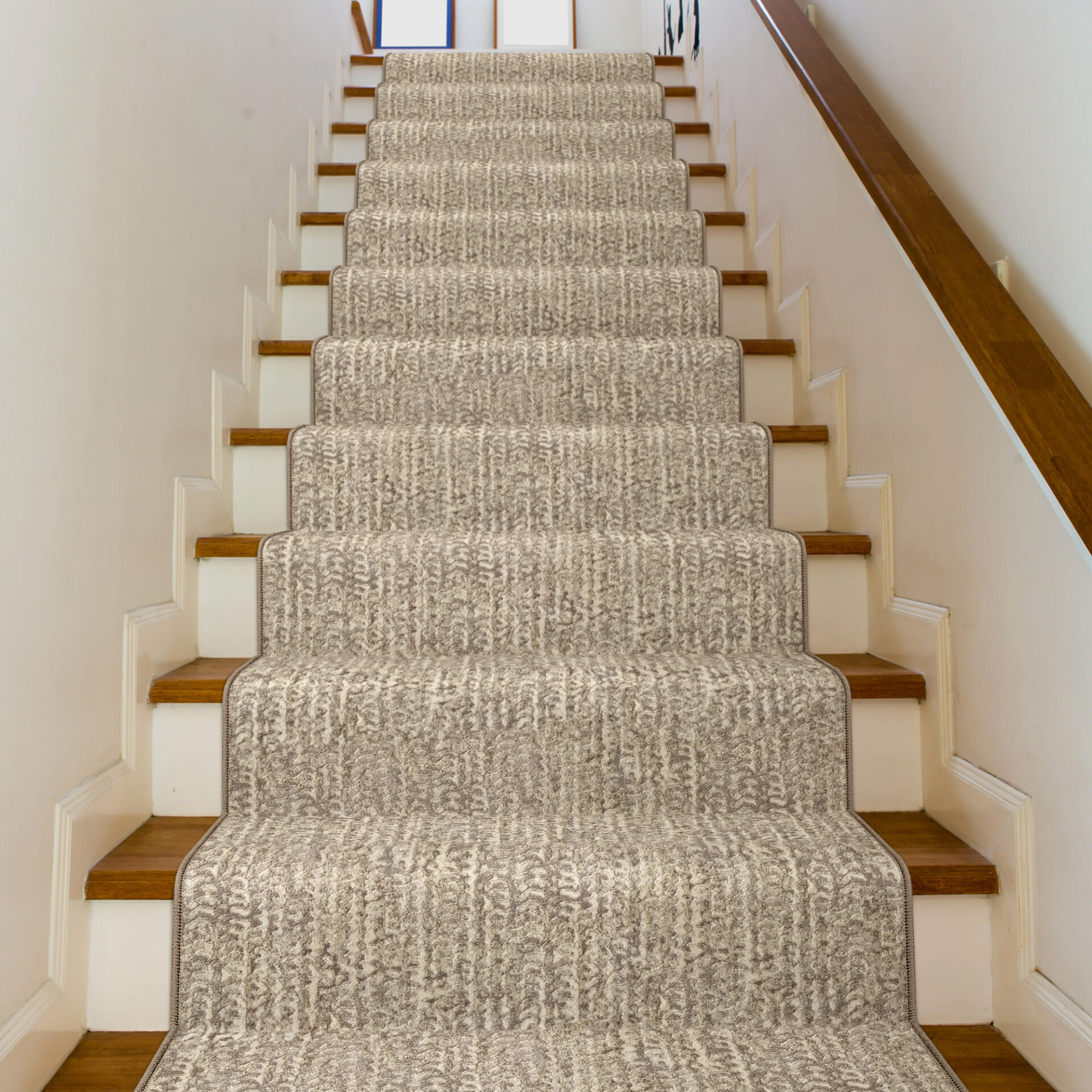 High-quality neutral beige staircase carpet runner with textured pattern, ideal for modern interior design.