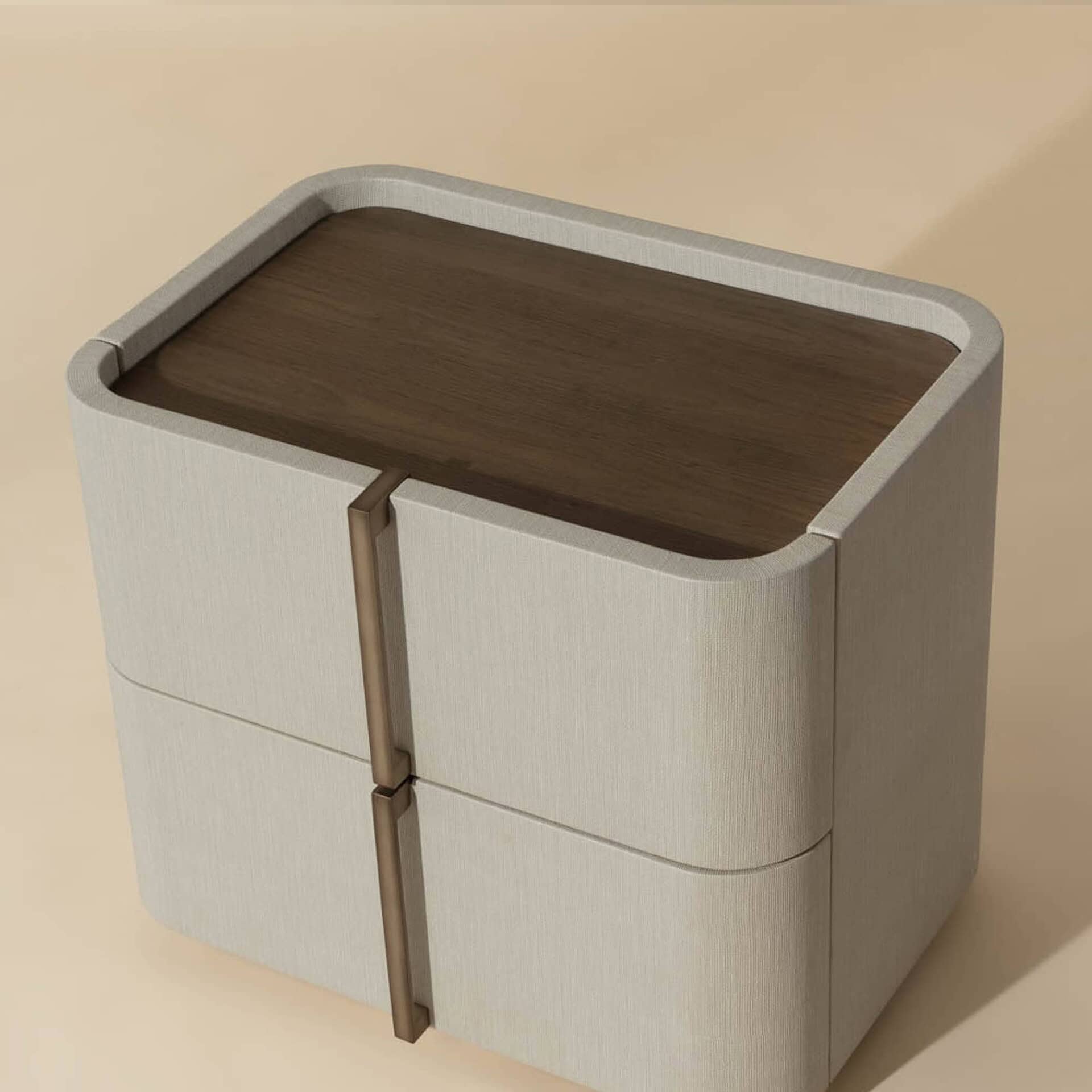 A modern nightstand with a light textured fabric body, dark wood top, and two vertical bronze handles, against a beige background.