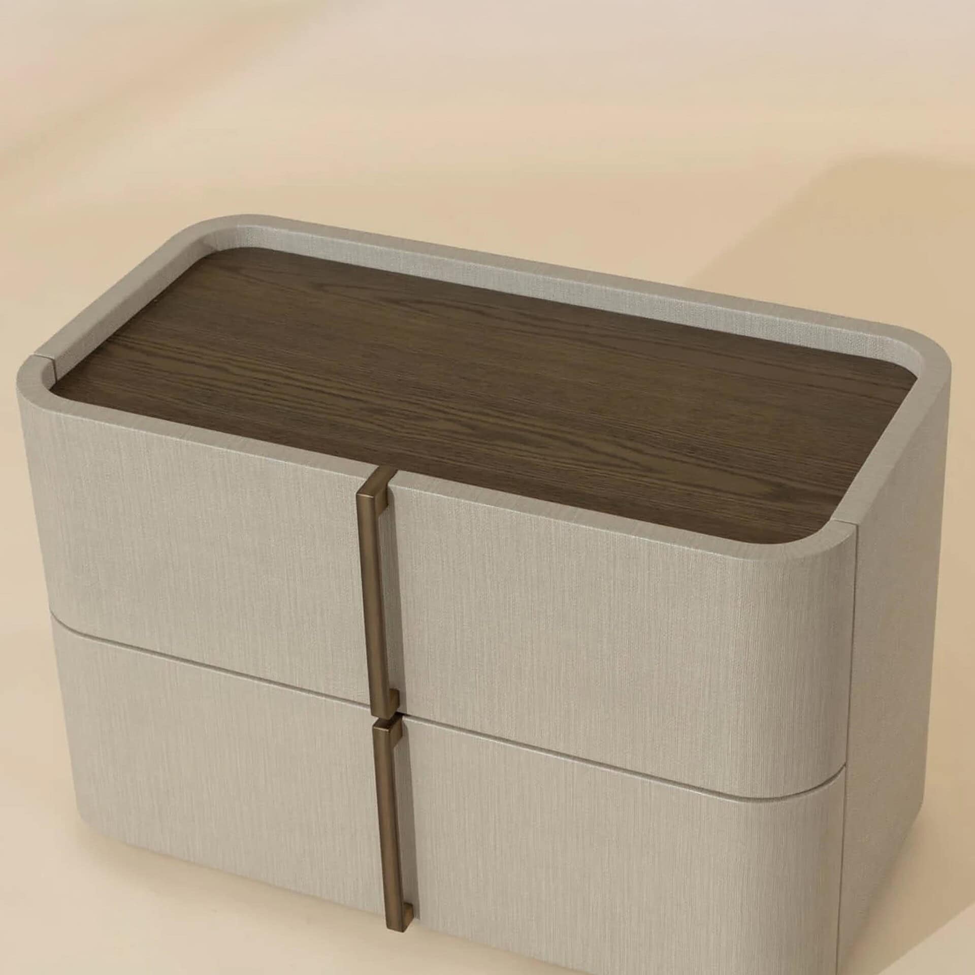 A modern light beige bedside table with a dark wood top and two bronze vertical handles, set against a plain background.
