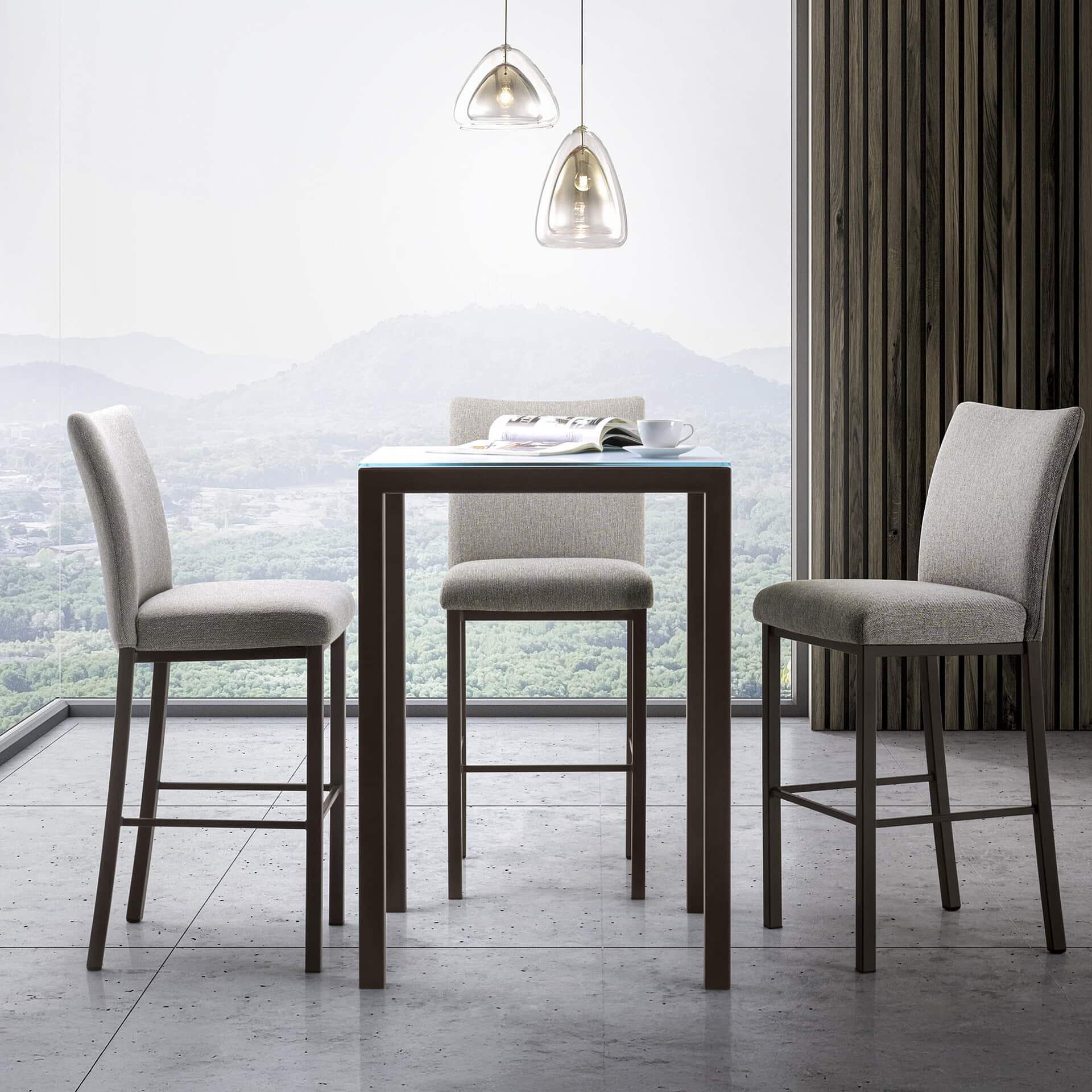 Quality modern dining chairs and table with scenic mountain view.