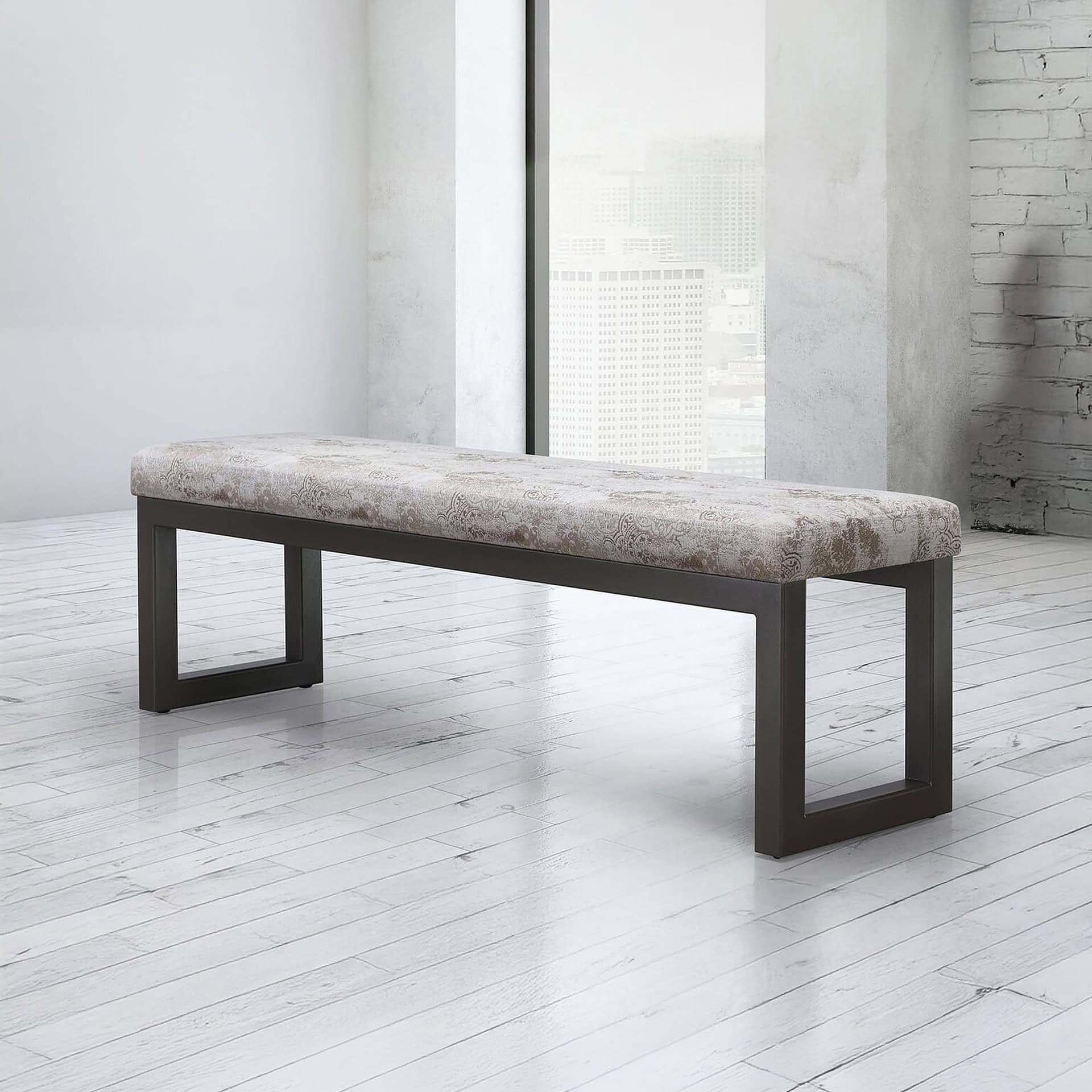 Modern upholstered bench with sleek black frame in minimalist interior.