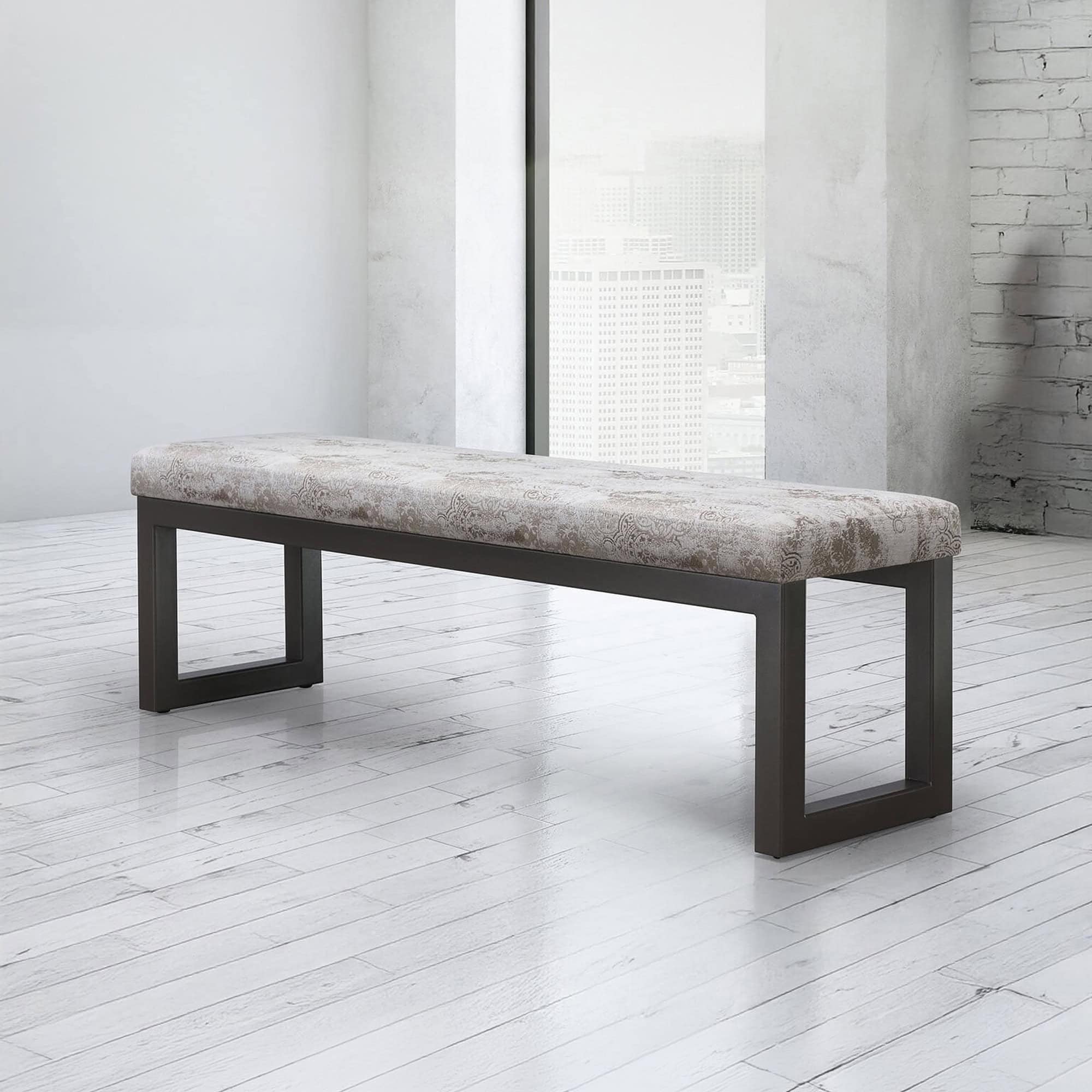 Modern upholstered bench with sleek black frame in minimalist interior.