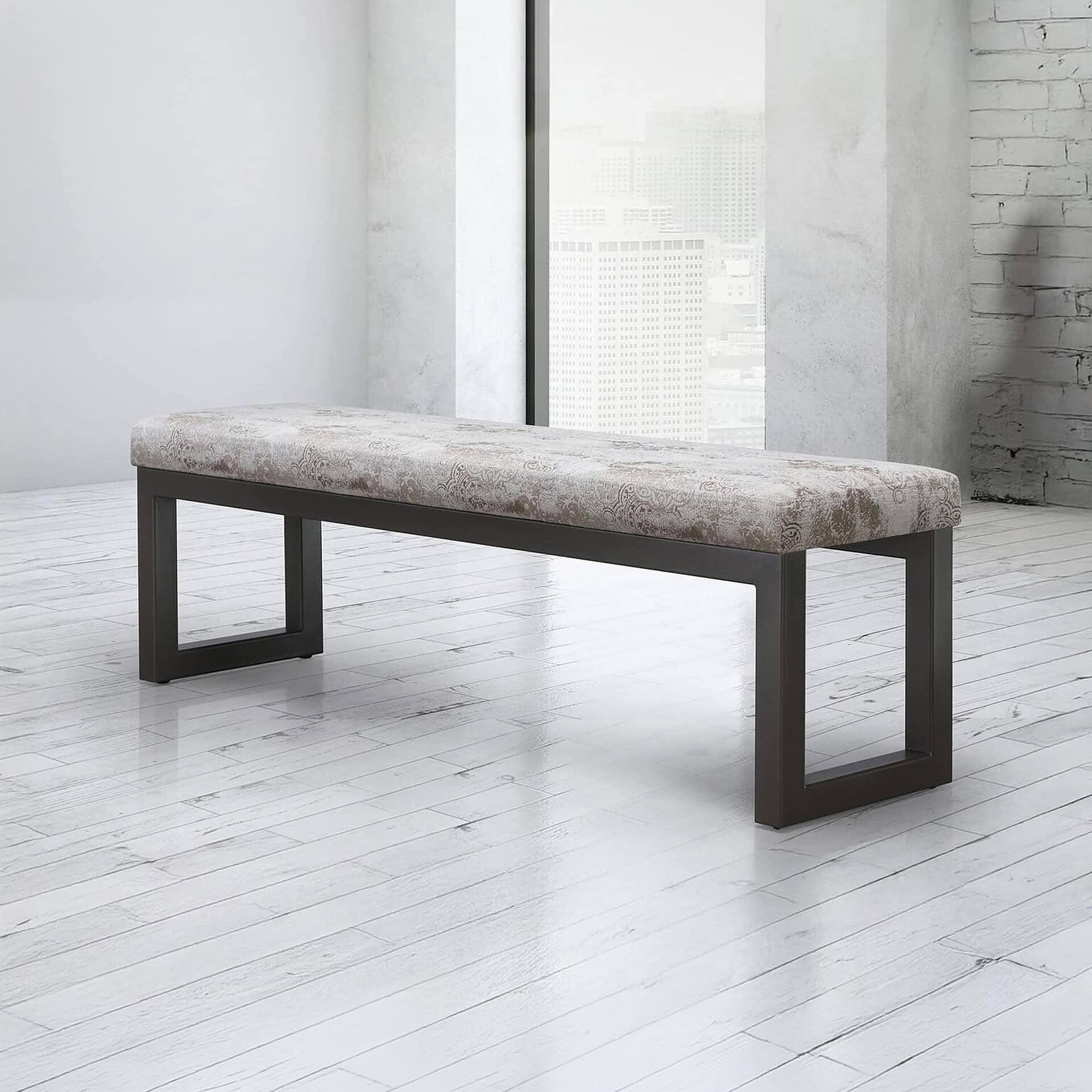 Modern upholstered bench with sleek black frame in minimalist interior.