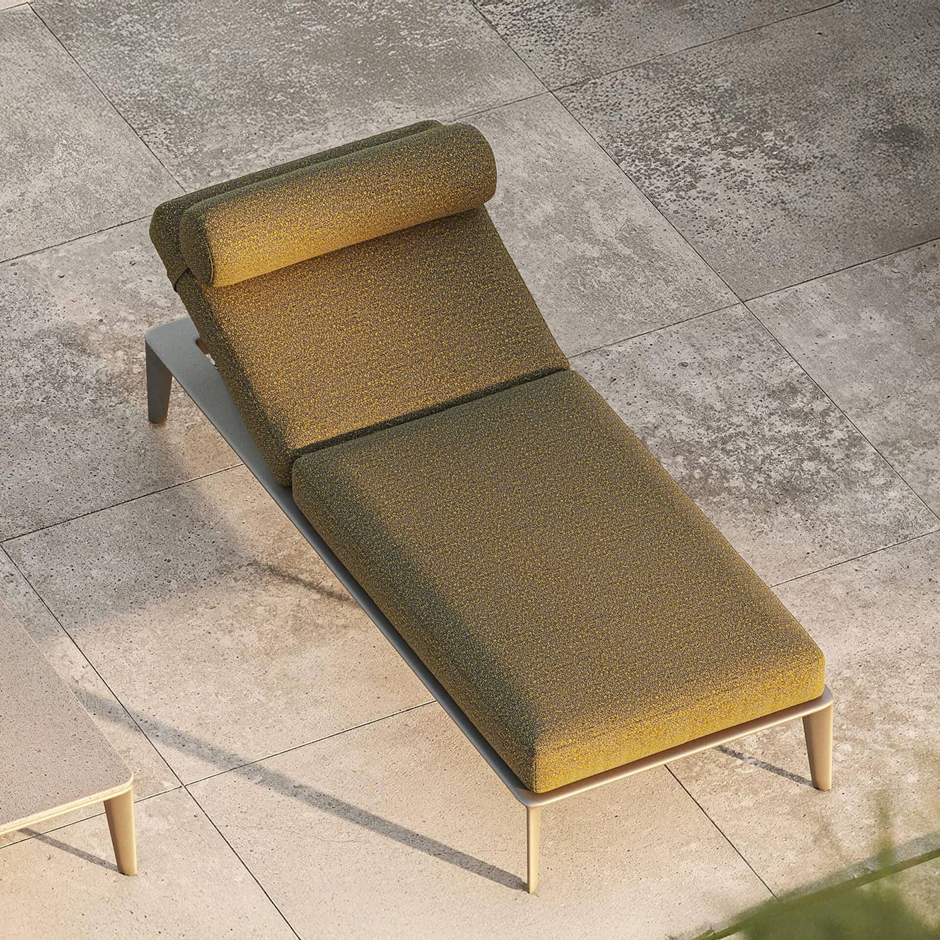 Contemporary lounge chaise with textured olive green upholstery and sleek modern design.