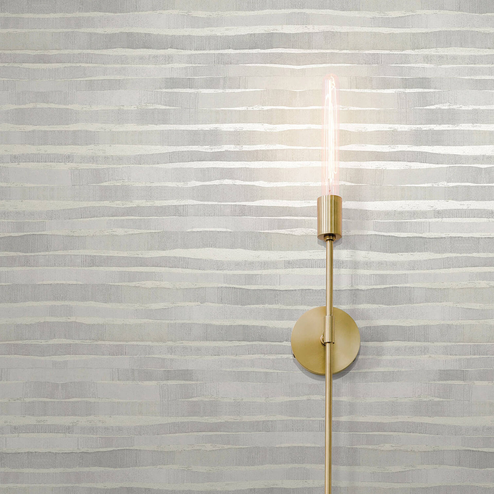 Elegant brass wall light with pink neon accent, suitable for contemporary home decor.