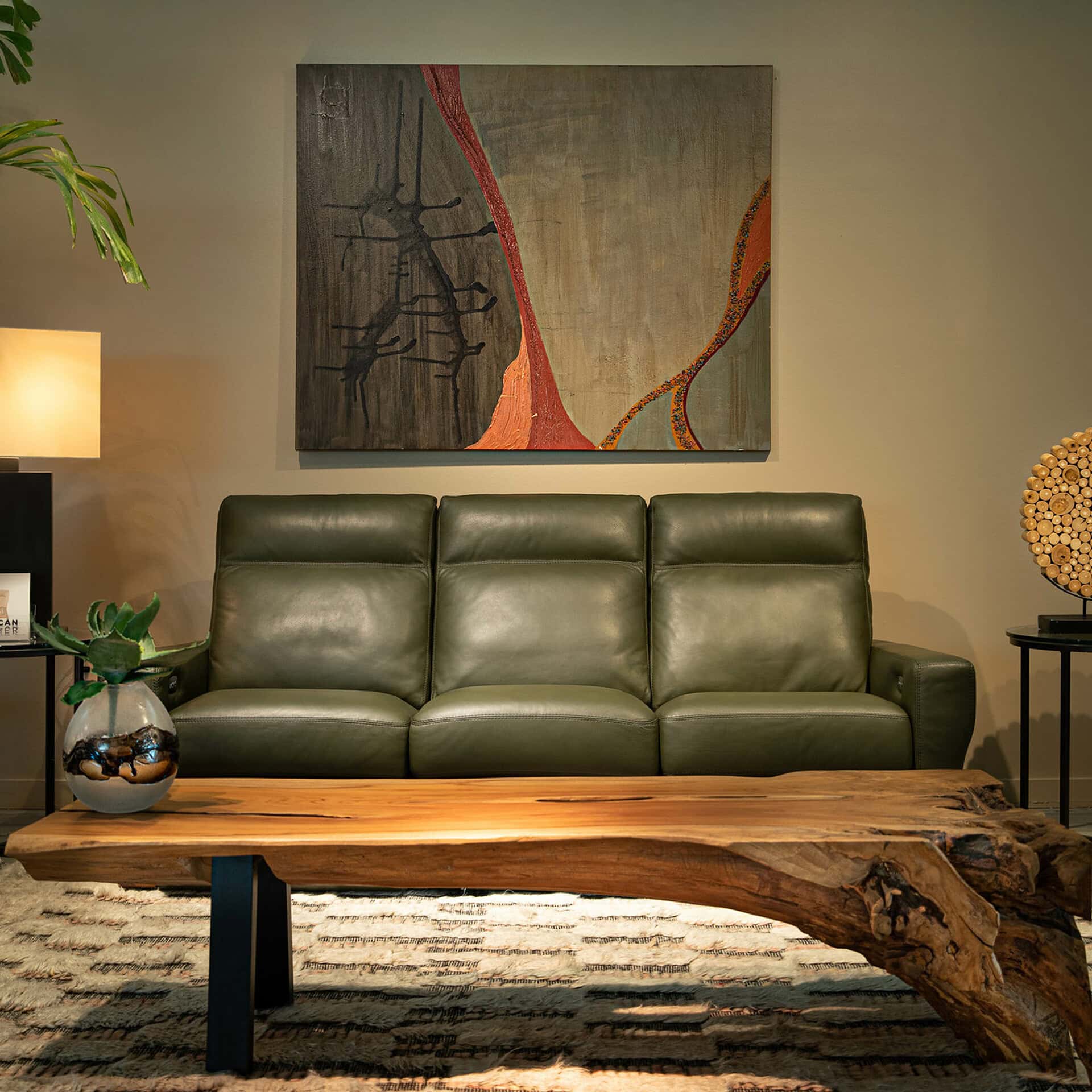 Green leather sofa with sleek design in contemporary living space.