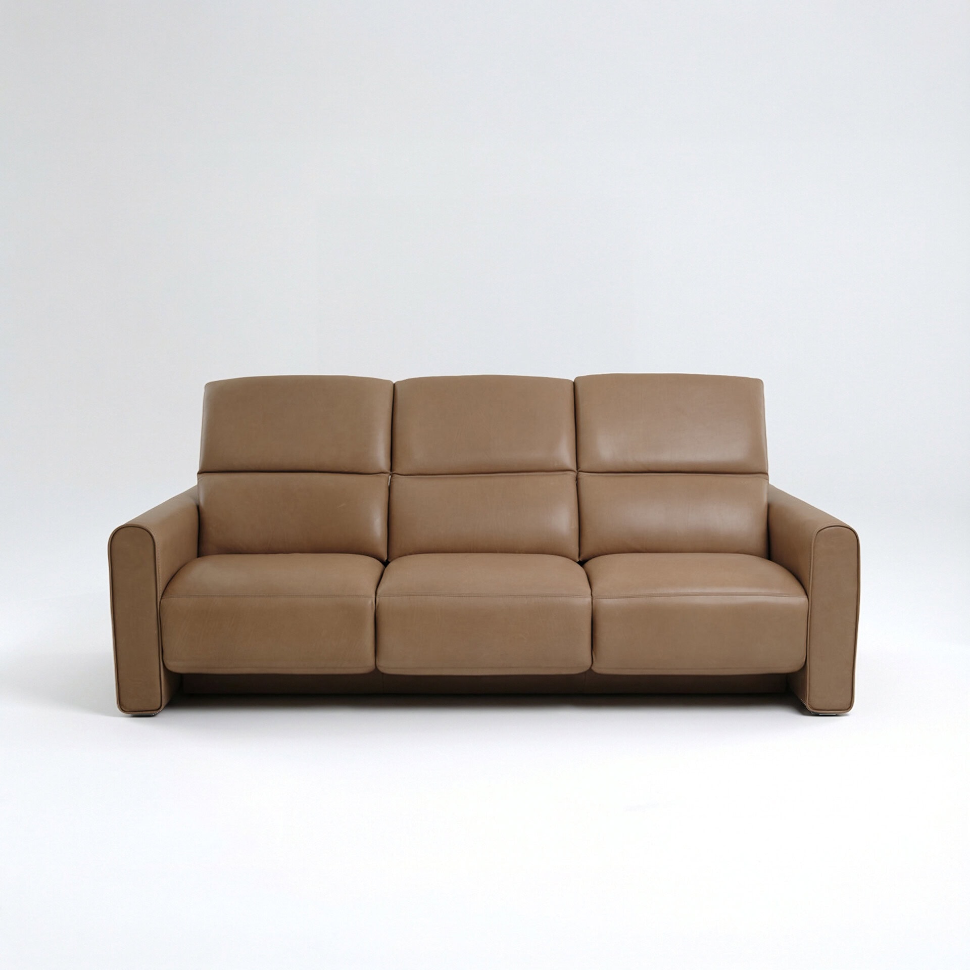 Beige leather sofa for modern living room decor.