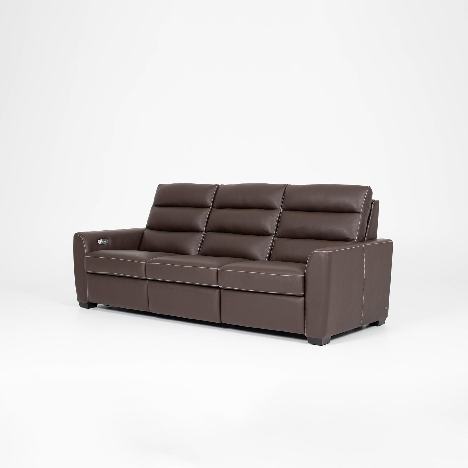 Brown leather sofa with plush cushions and sleek design.