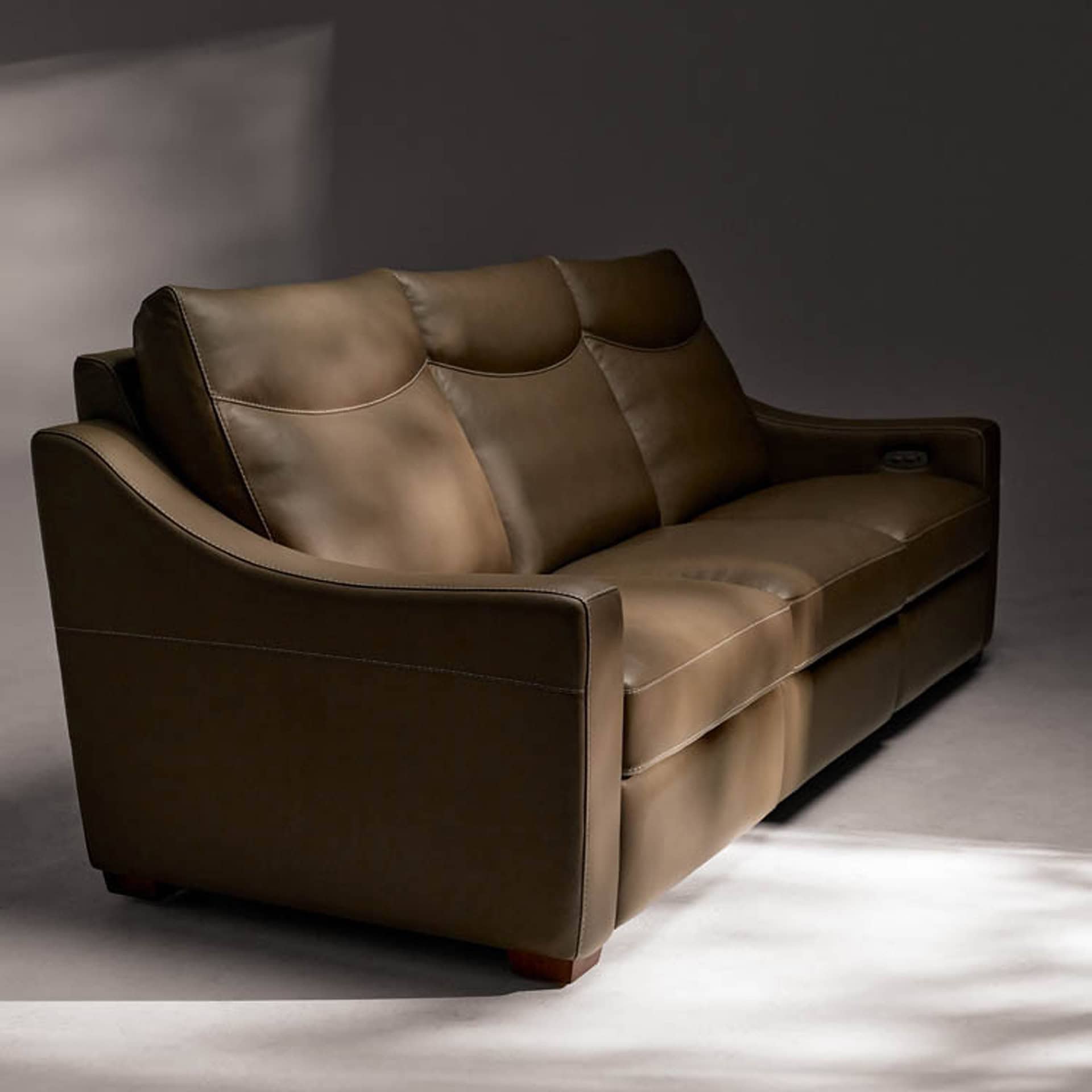 Leather sofa with sleek design and plush cushions for comfort. Perfect addition to contemporary livi.