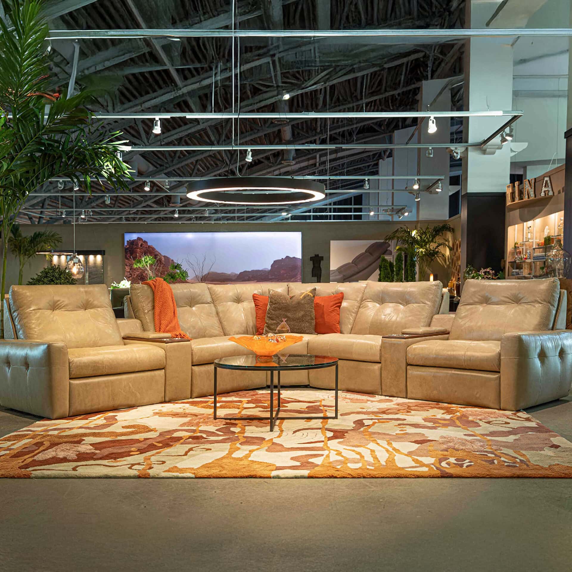 Elegant beige leather sectional sofa in a contemporary showroom setting.