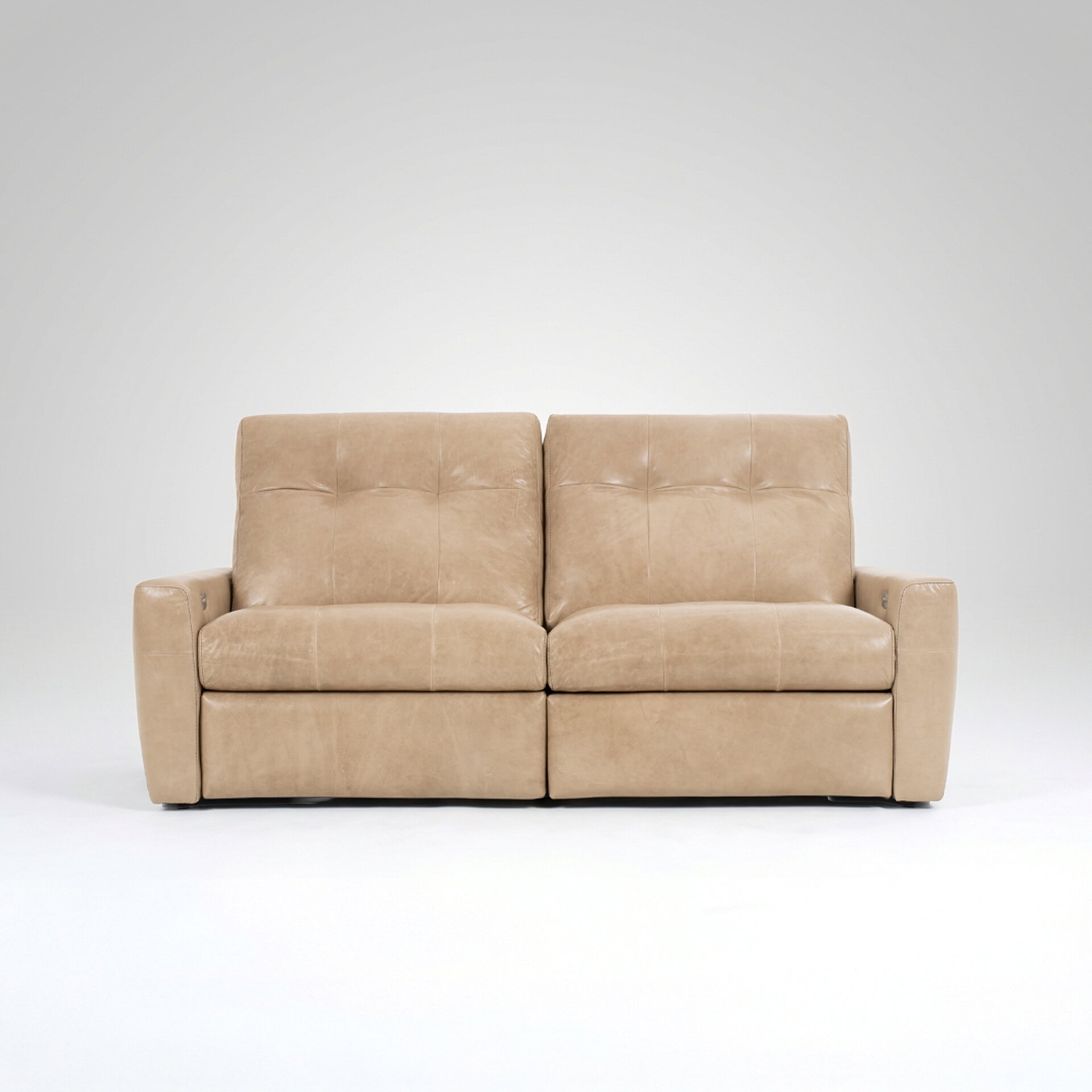 Beige upholstered sofa with plush cushions and armrests.