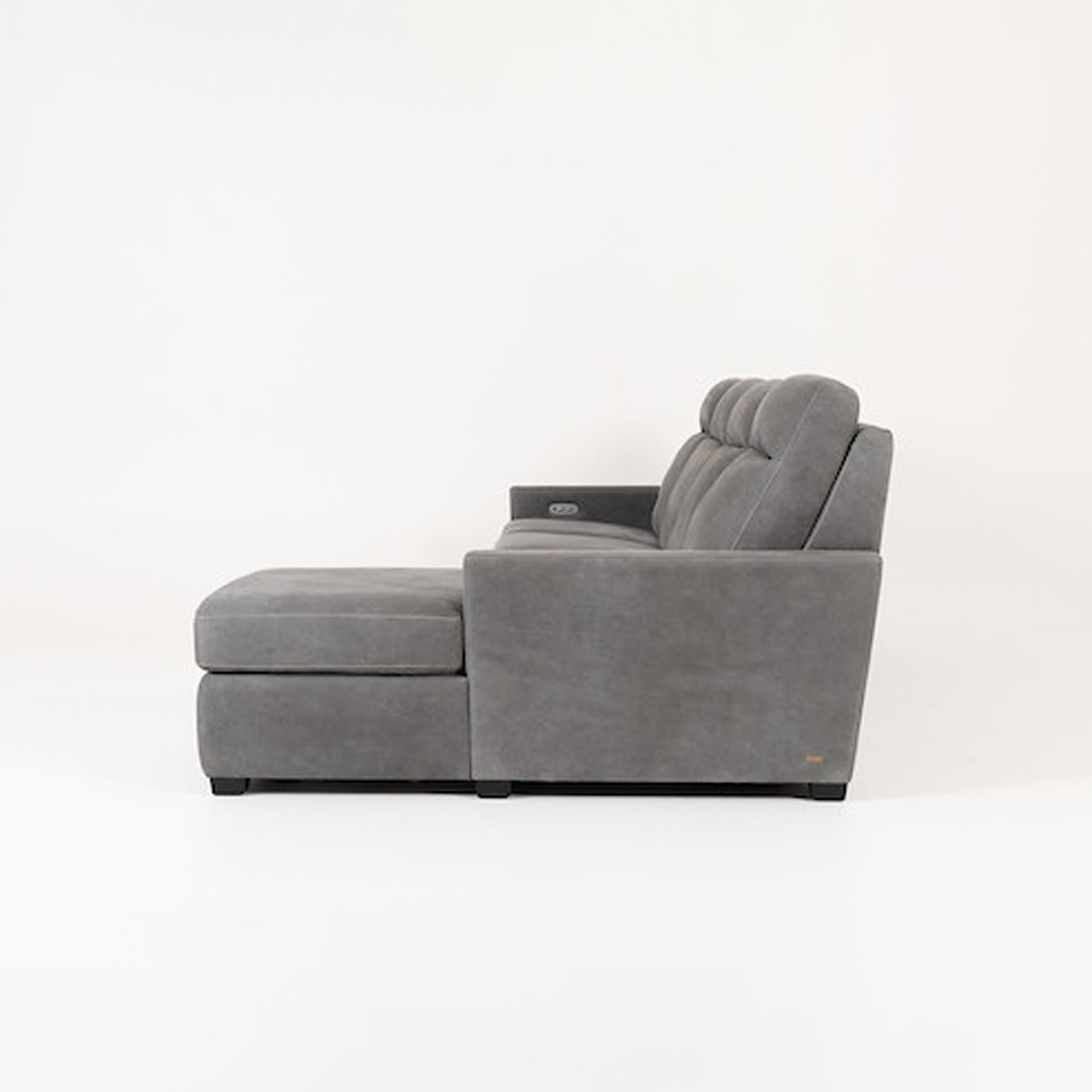 Gray sectional sofa with plush cushions, perfect for contemporary living rooms.