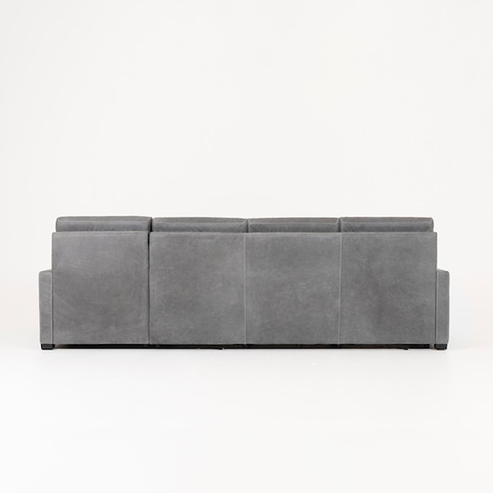 Gray sofa with clean lines and plush cushions, ideal for contemporary living spaces.