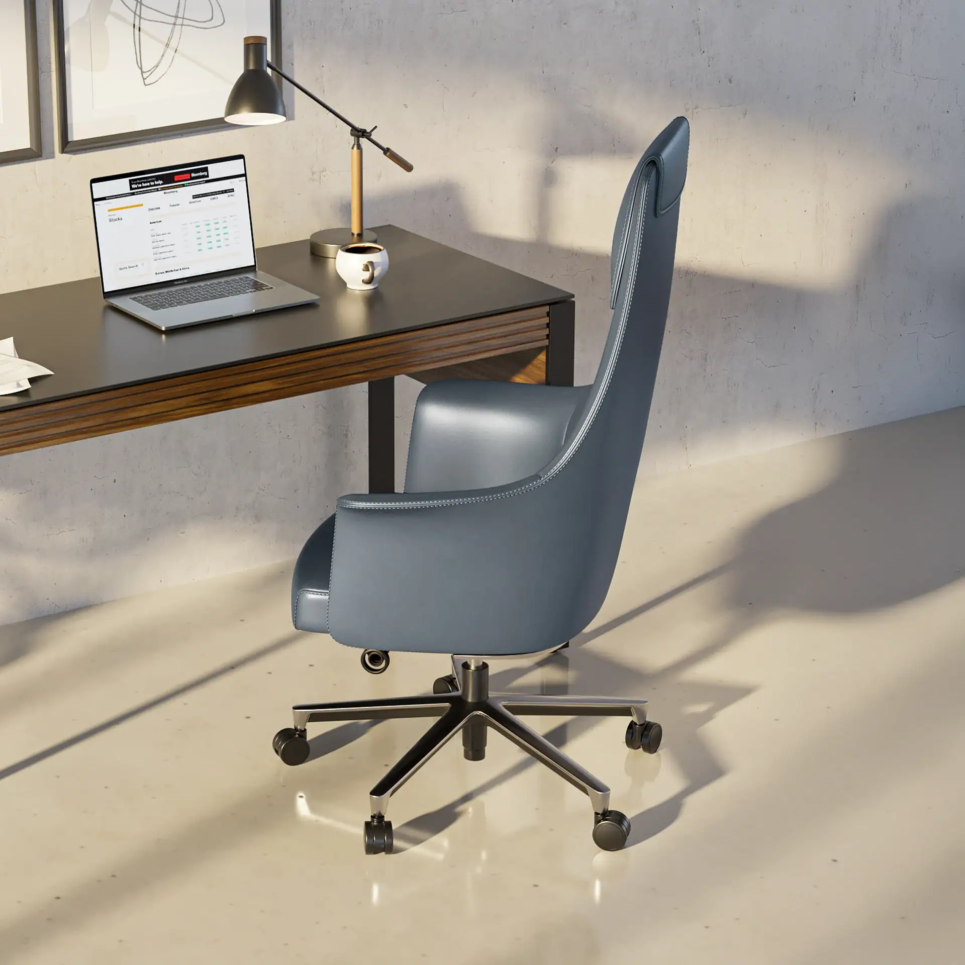 A blue leather office chair and a laptop on a dark wood desk in a modern office setting with a concrete wall and sunlit floor.