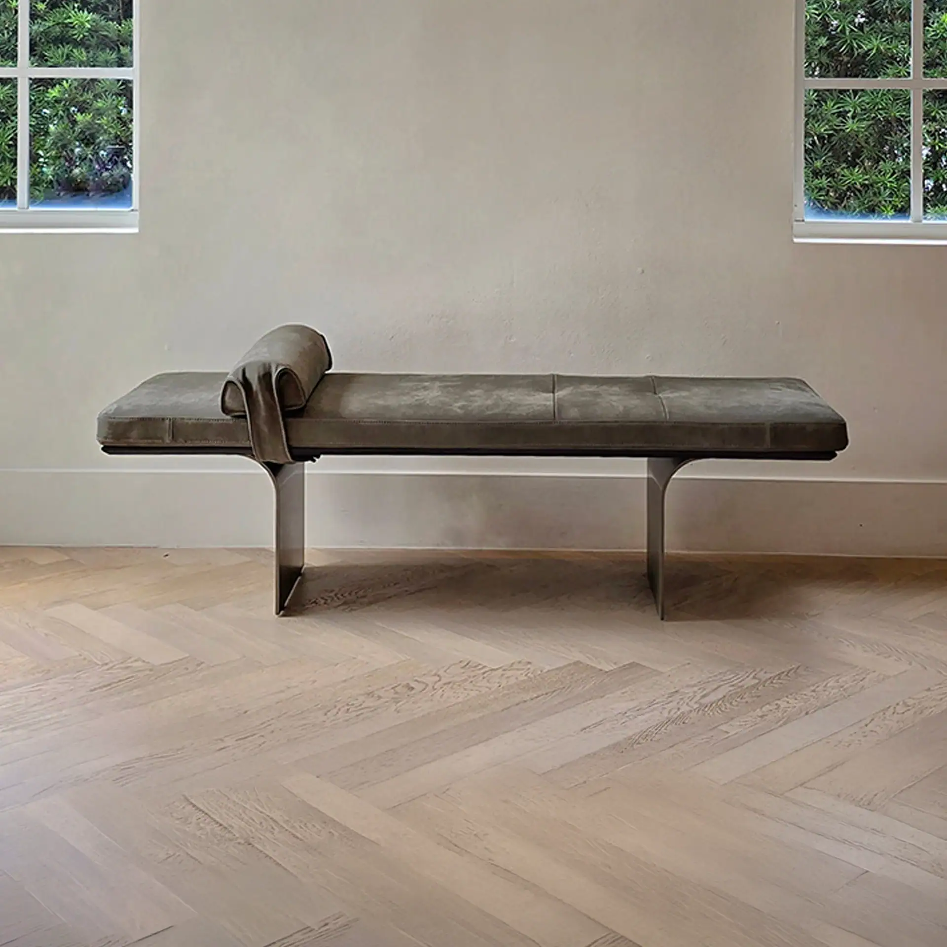 Minerva Bench by Sklar Furnishings in a minimal room with large windows.