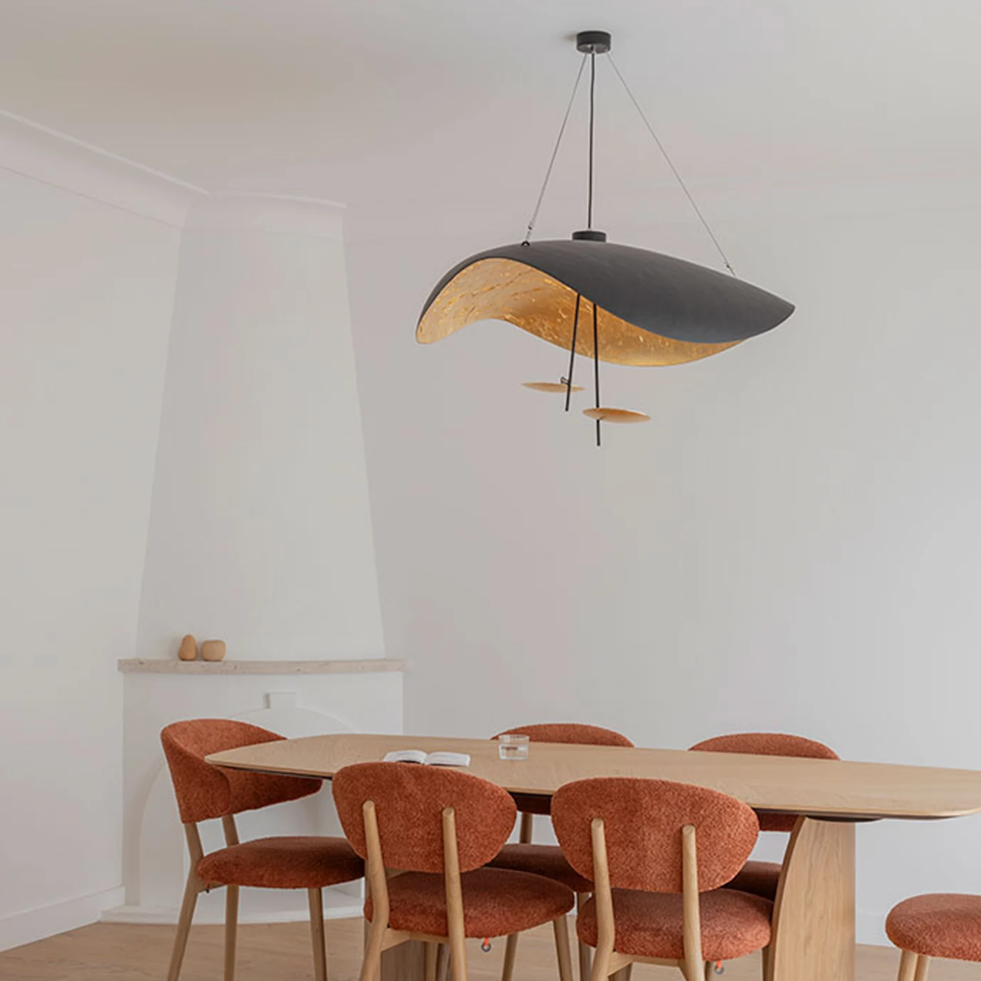 Lederam Manta S2 suspension pendant hanging above dining table in modern room.