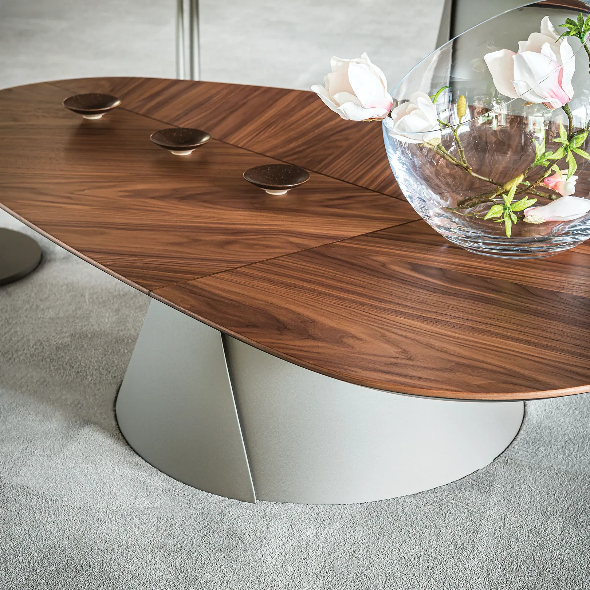 Sklar Furnishings coffee table with wood veneer top and sculptural base.