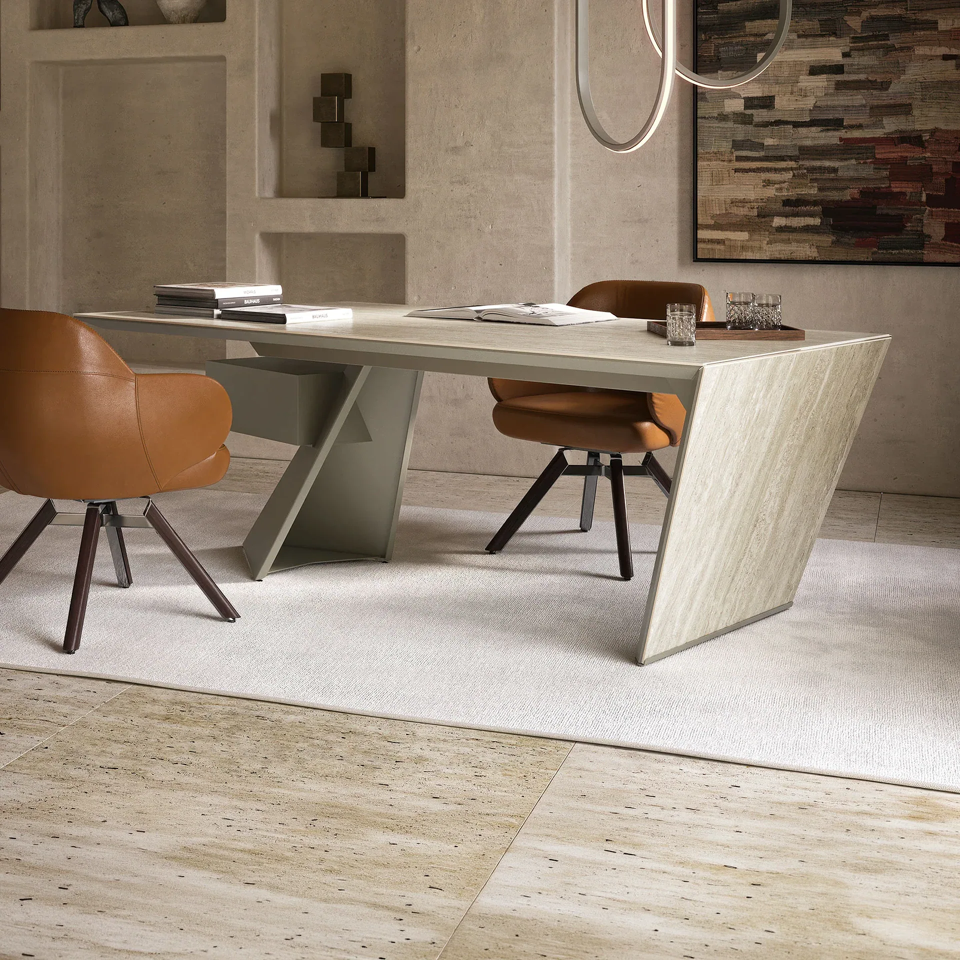 A modern home office with an angular light-colored desk, two brown leather chairs, a light rug, textured walls with built-in niches, and abstract art.