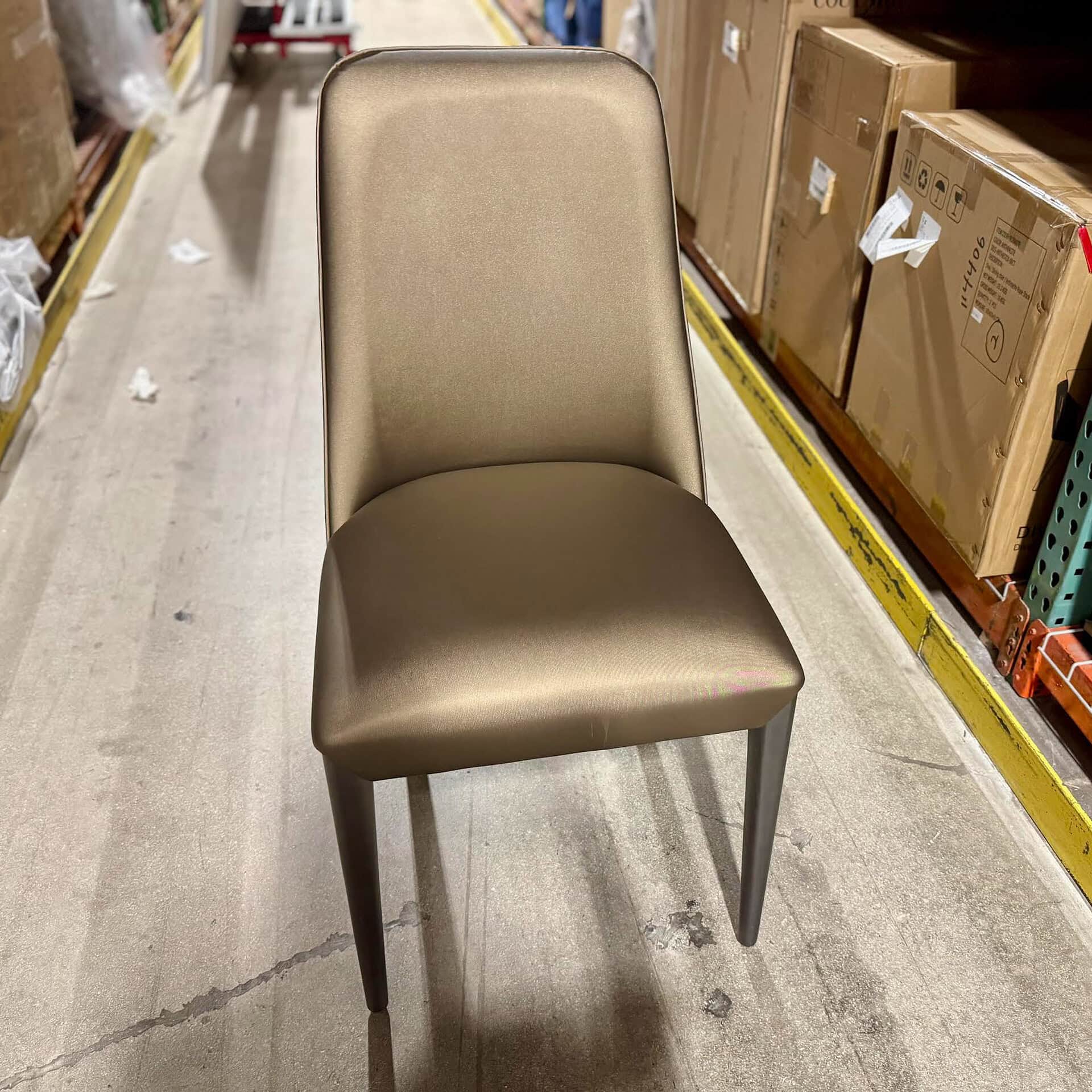 Elegant beige upholstered chair for dining or office use.