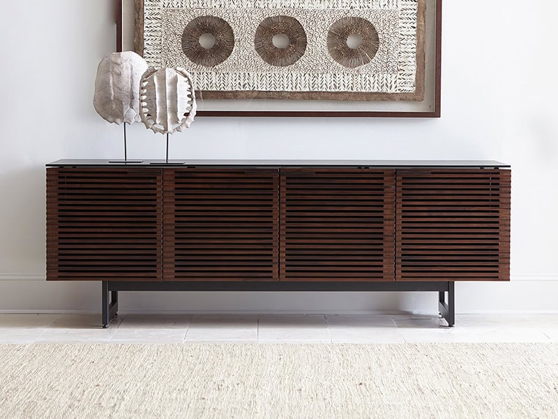 Stylish wooden sideboard with slatted doors for contemporary living spaces.
