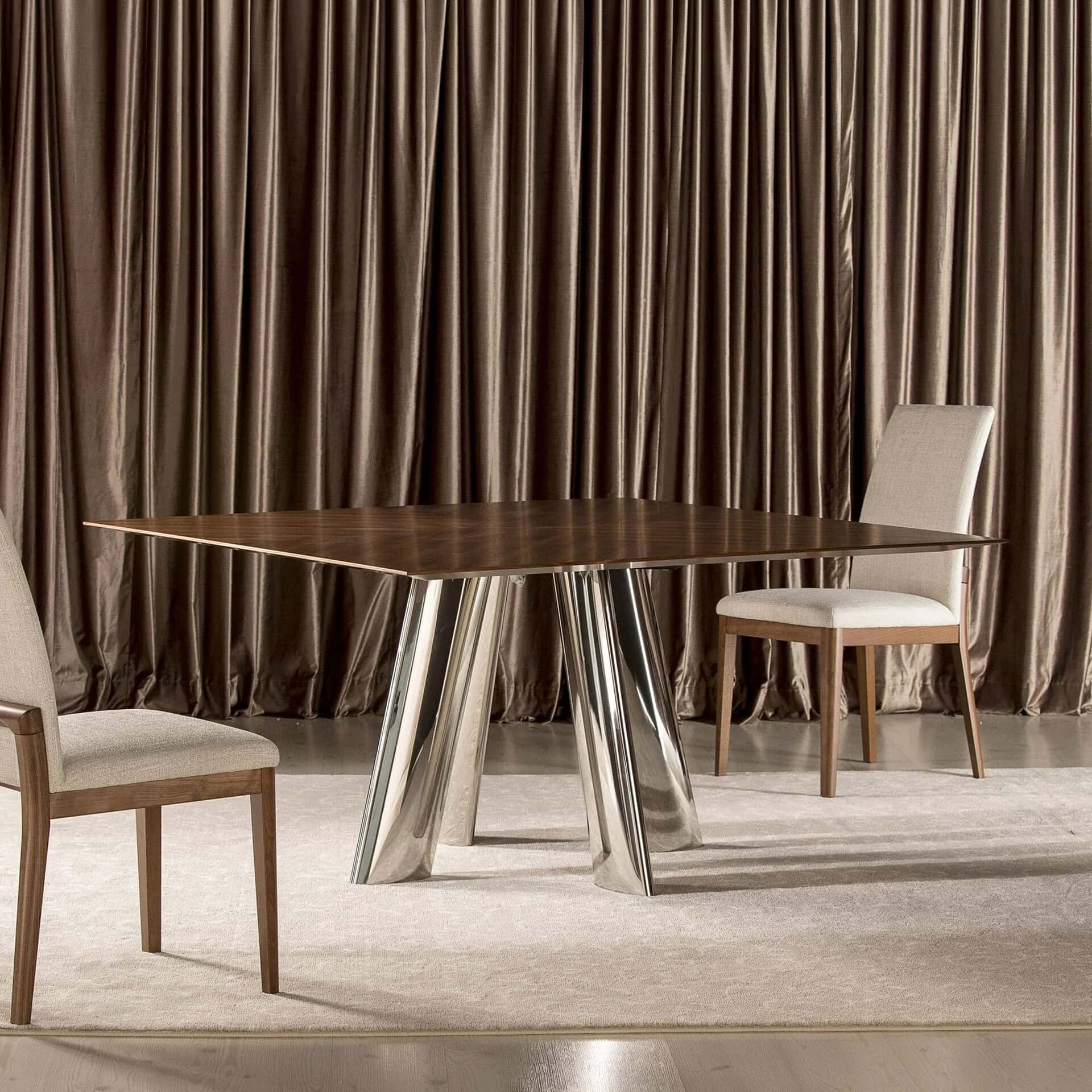 Stylish round dining table with contemporary chairs in a sophisticated interior setting.