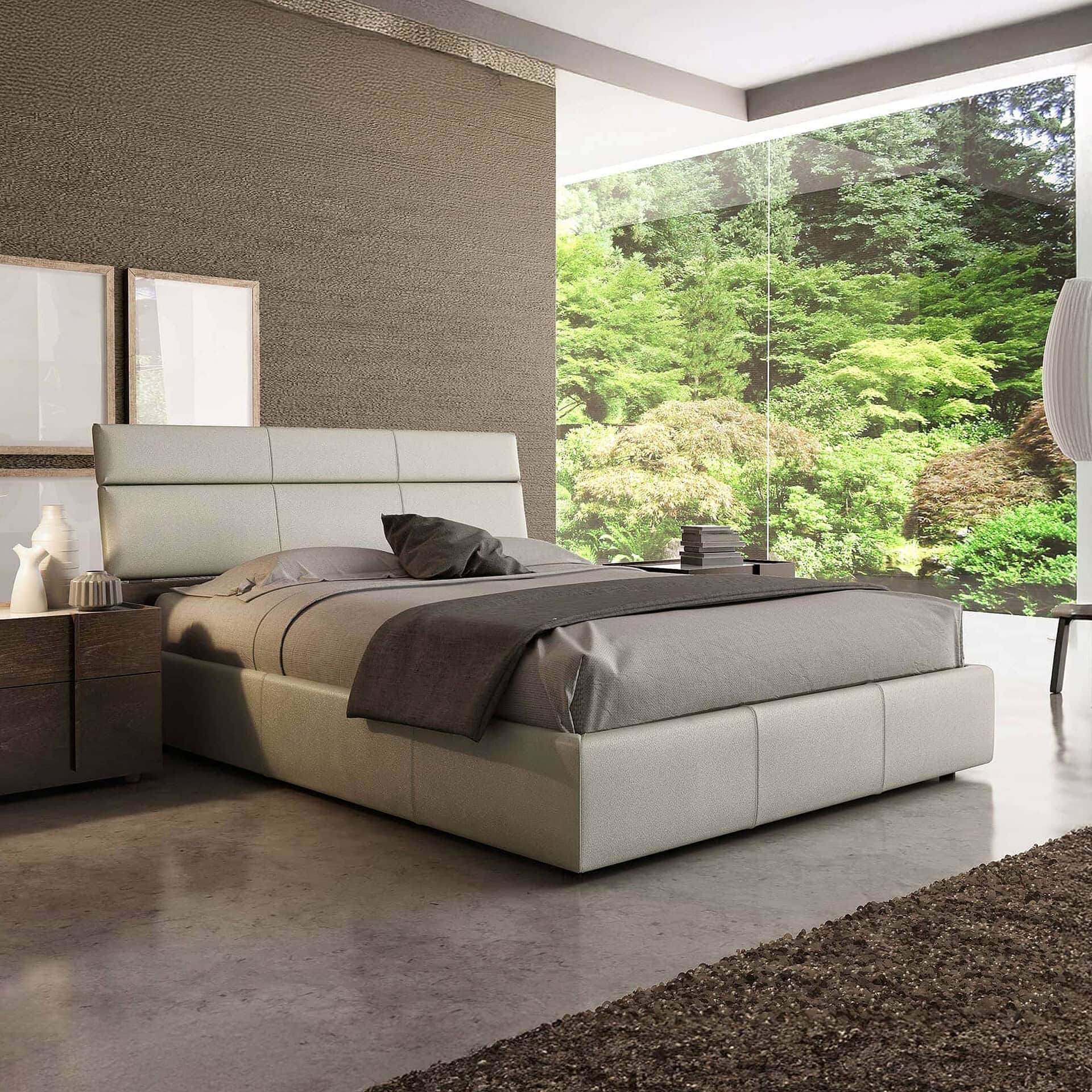 Contemporary bedroom with sleek furniture and scenic outdoor view.