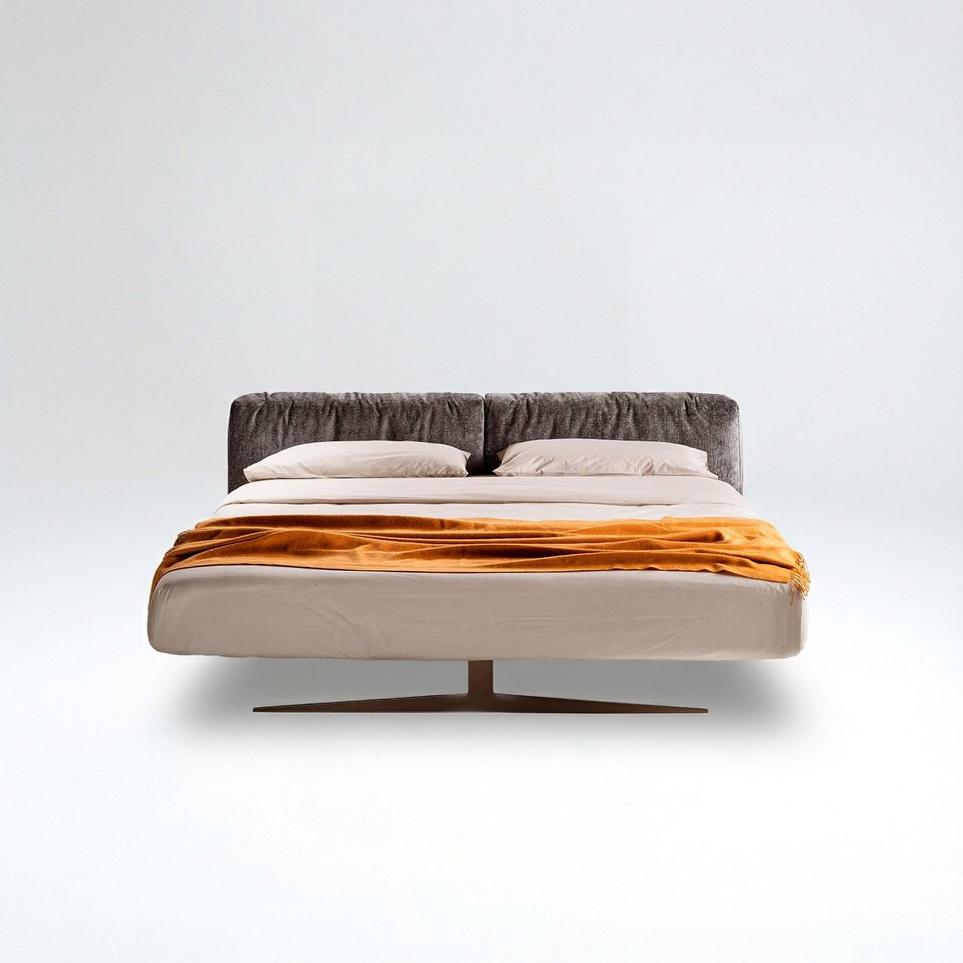 Upholstered bed with gray headboard and beige bedding, showcasing contemporary bedroom furniture.