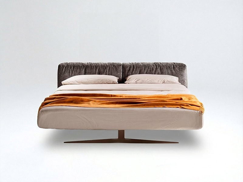 Contemporary upholstered bed with gray headboard and beige bedding, perfect for stylish bedrooms.