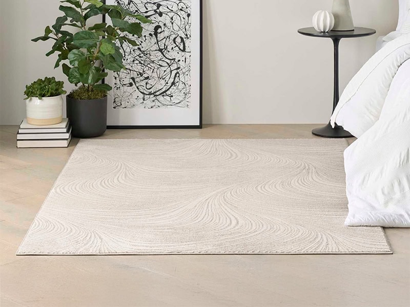 Rug for contemporary bedroom decor with soft, neutral tones and subtle textured patterns.