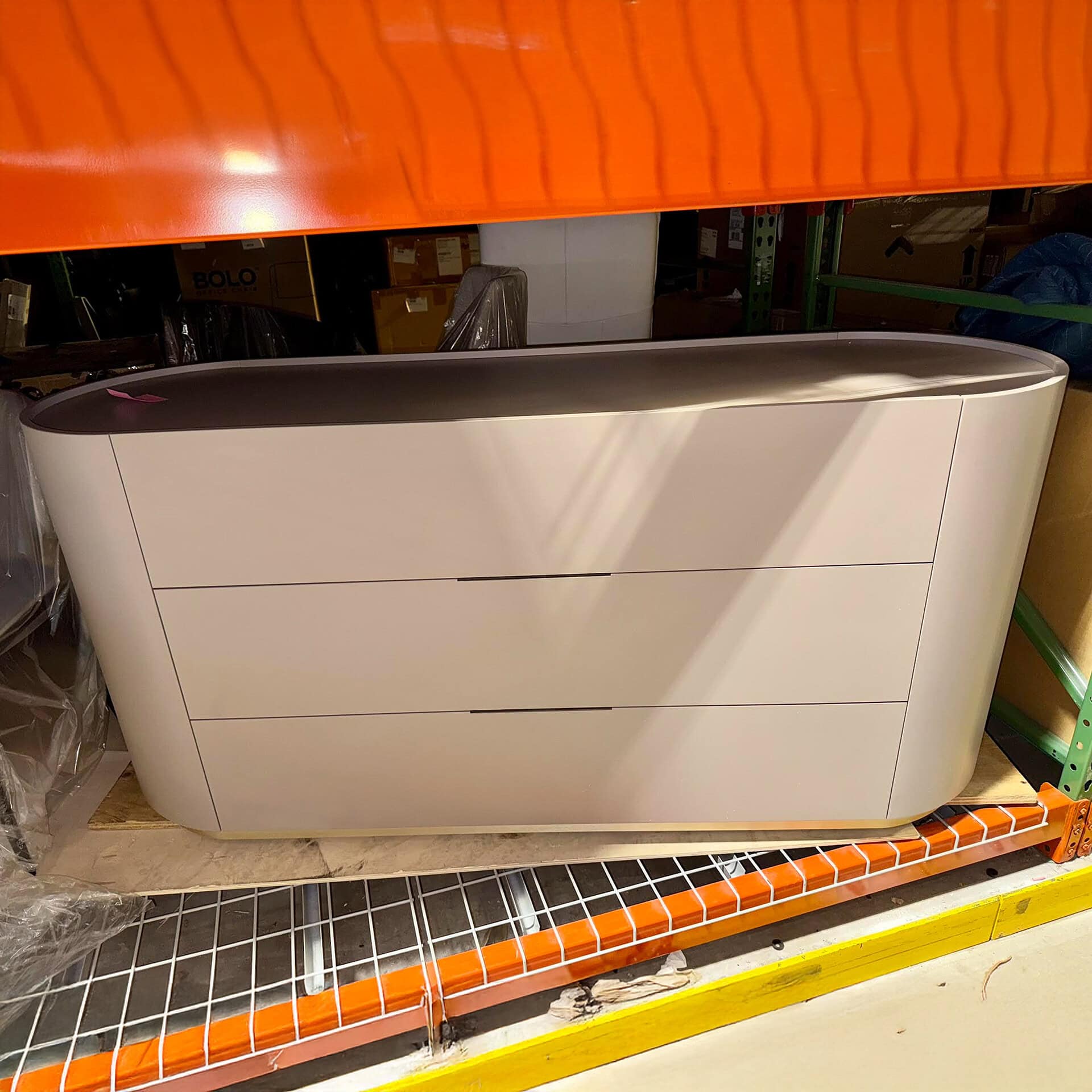 Modern white dresser with sleek design and three spacious drawers. Perfect for contemporary bedroom.