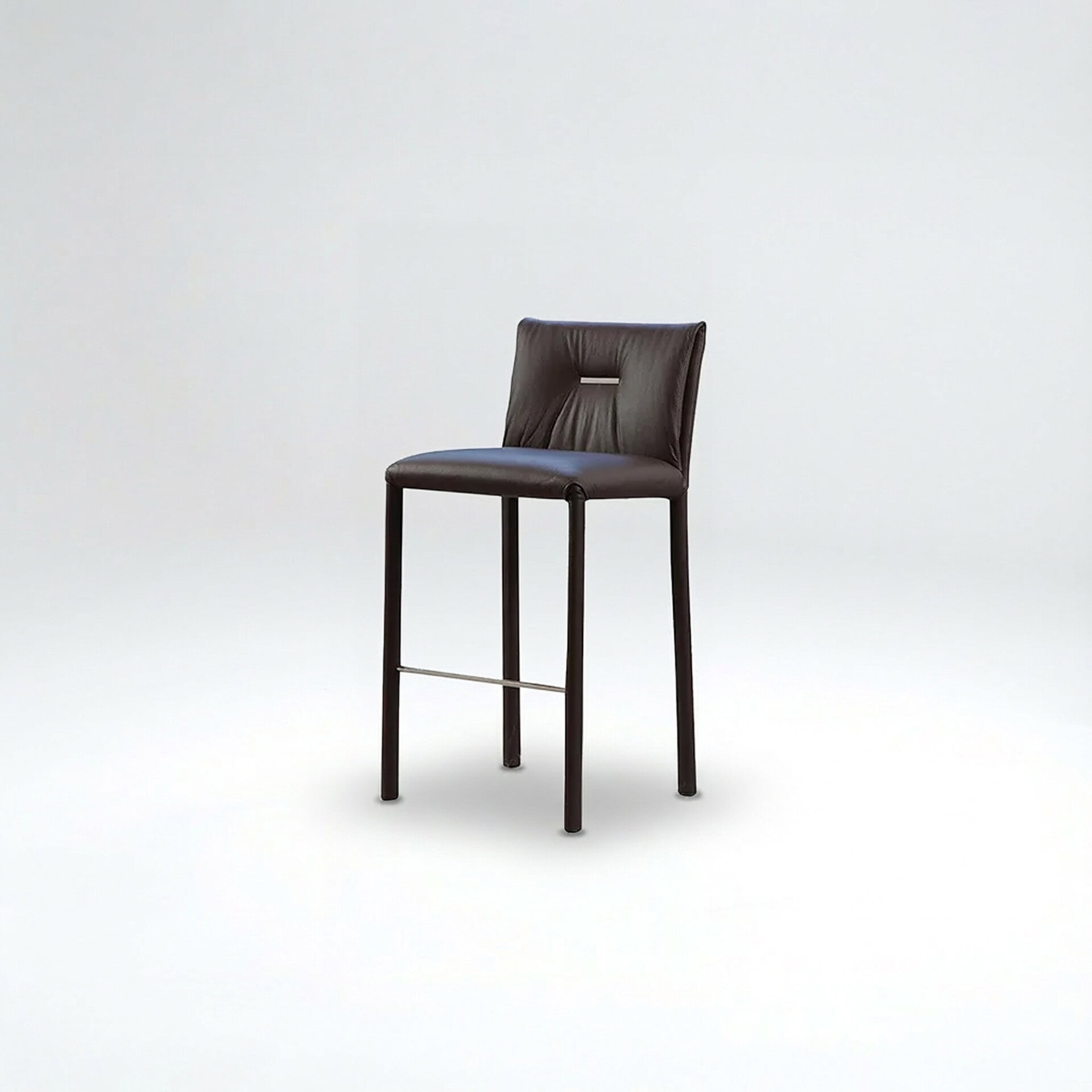 Leather bar stool with a sleek design, padded seat, and backrest for comfort. Perfect for kitchens,.