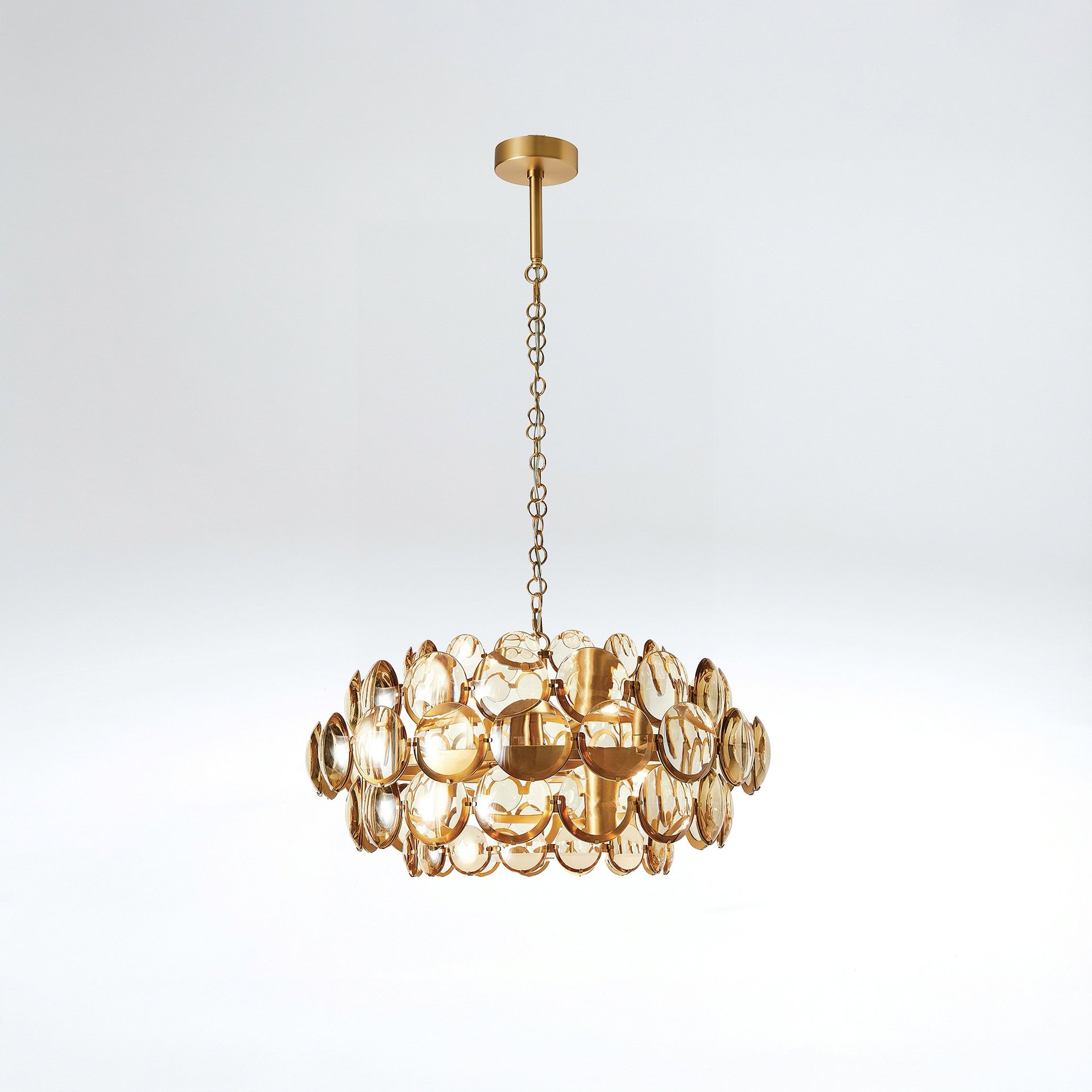 Elegant gold chandelier with circular accents for modern interior lighting.