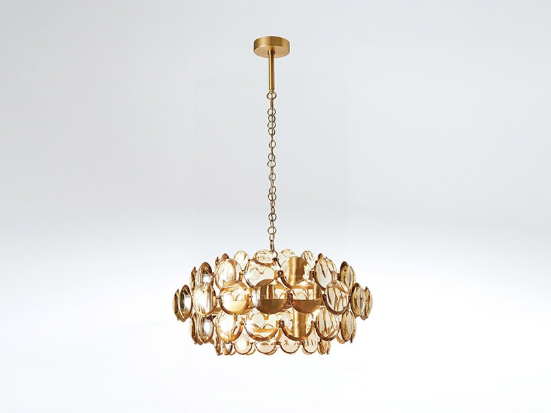Elegant gold chandelier with circular glass accents for luxurious lighting.