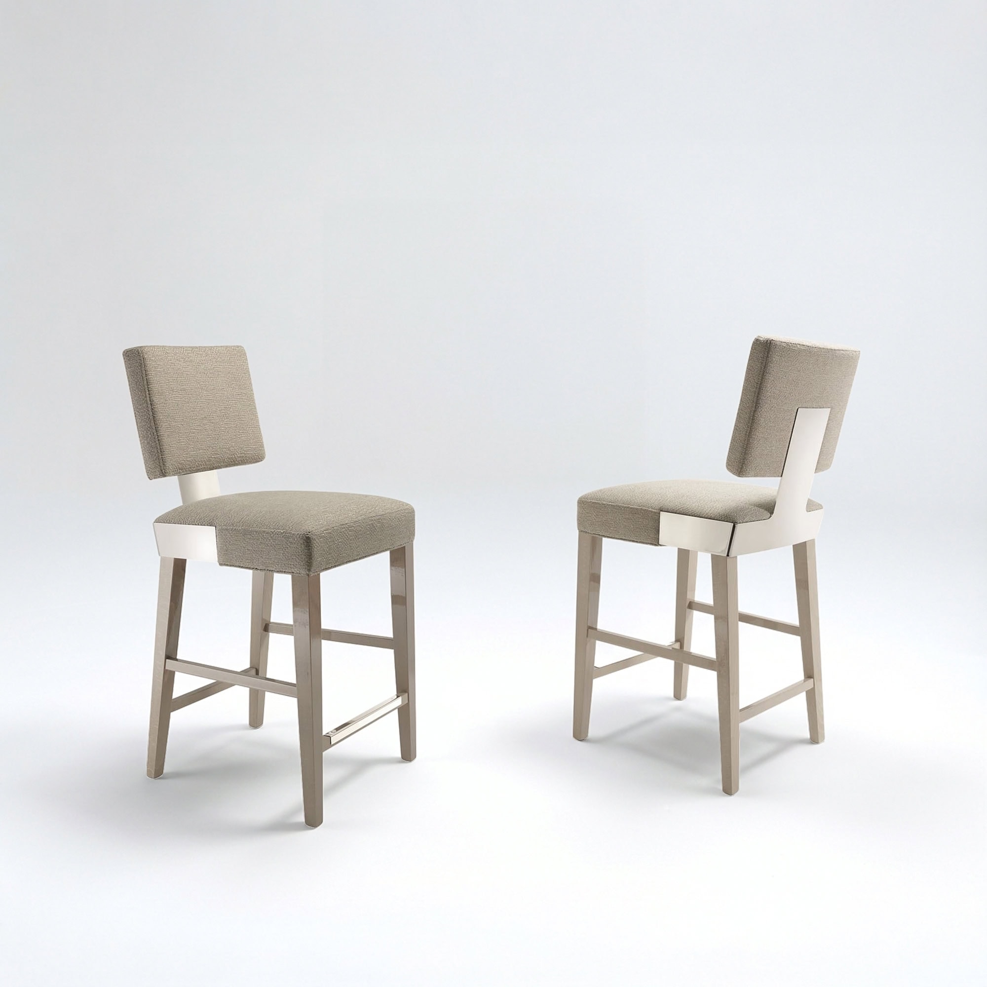 Upholstered dining chairs with light wood frames and neutral fabric cushions.