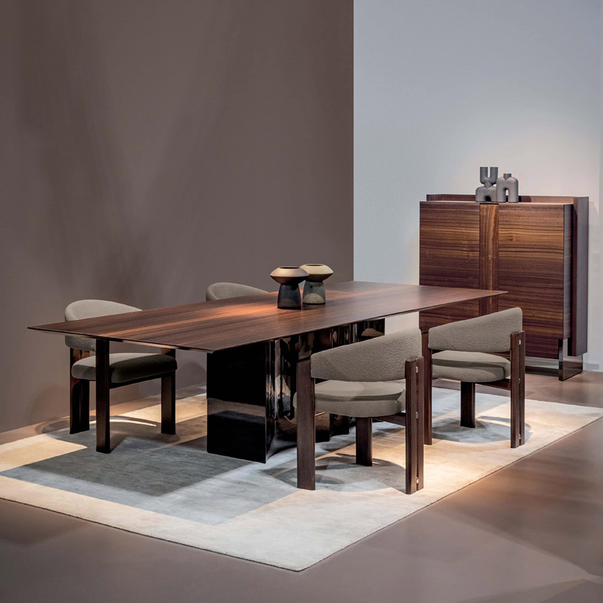 Elegant wooden dining table with six upholstered chairs and a matching sideboard in a contemporary s.