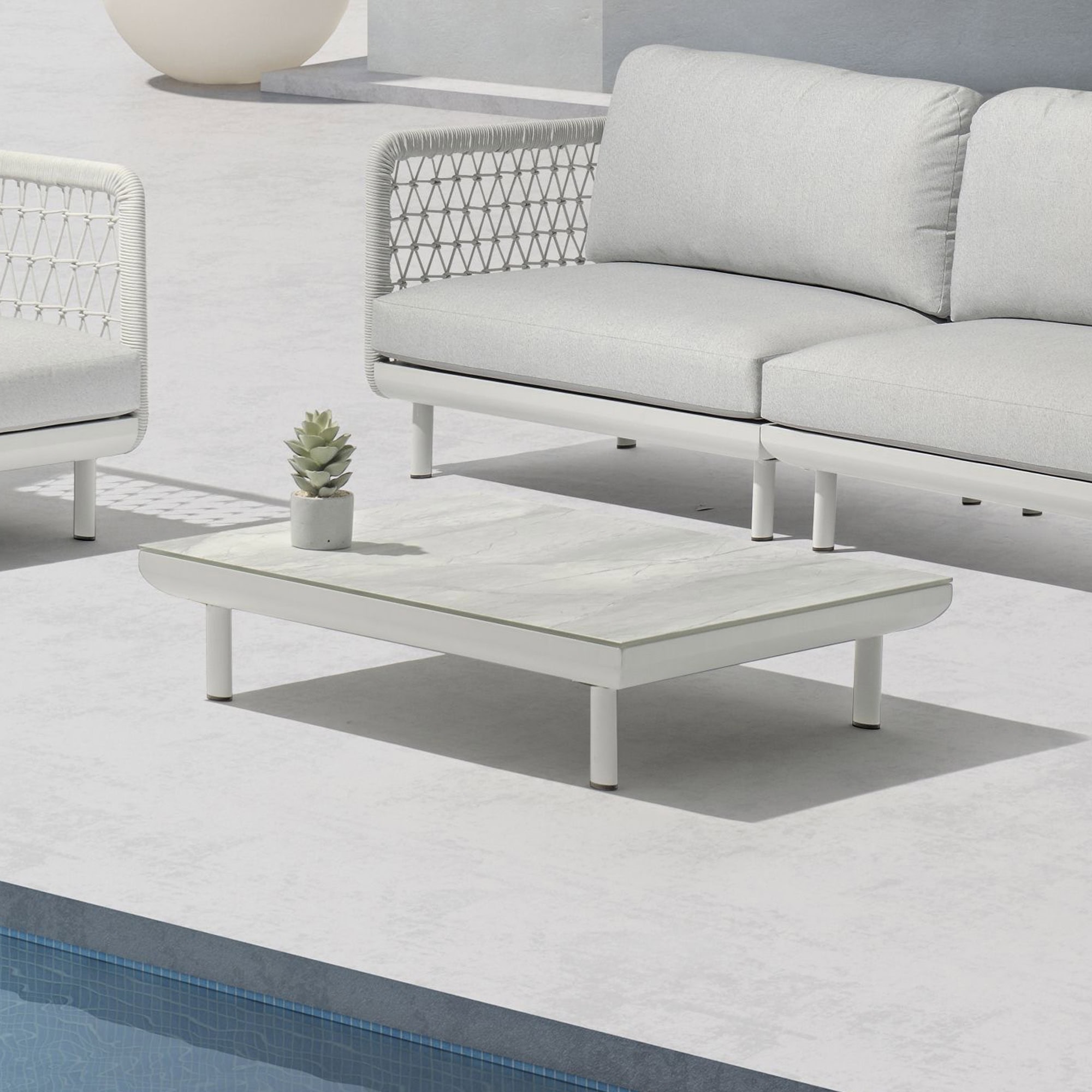 Elegant outdoor furniture with sleek design and comfortable cushions.