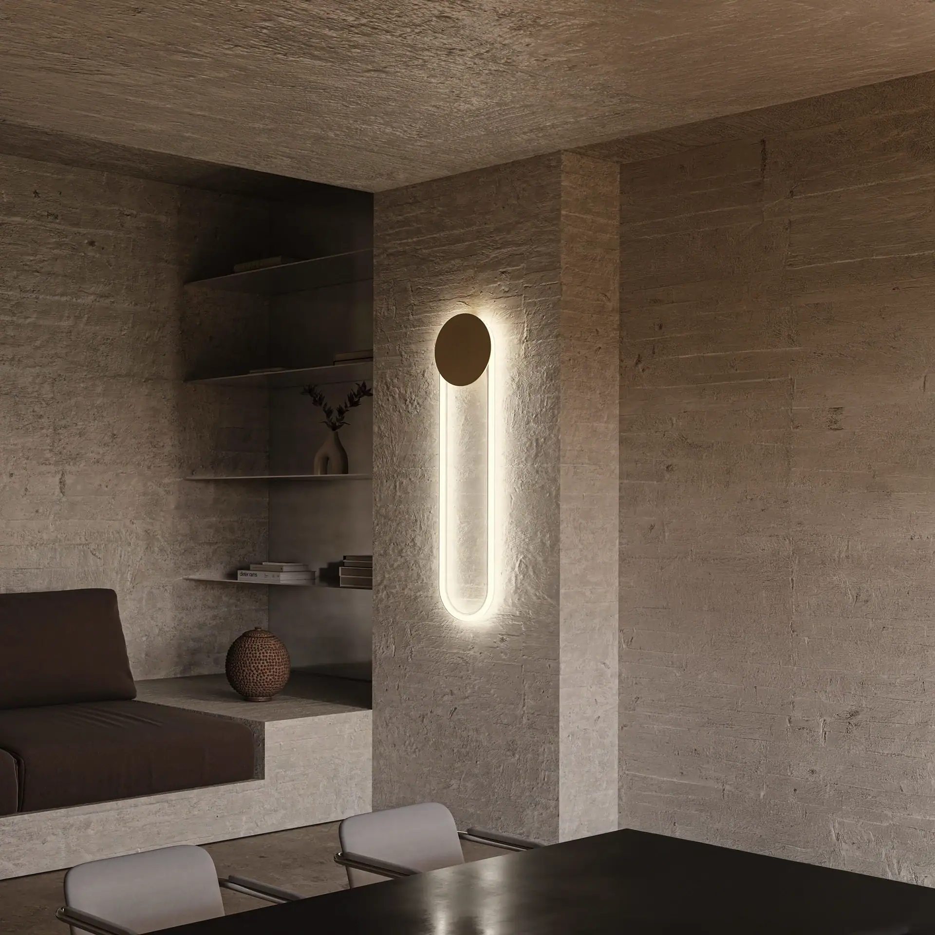 Sklar Furnishings RA Sculptural Wall Sconce on concrete wall.